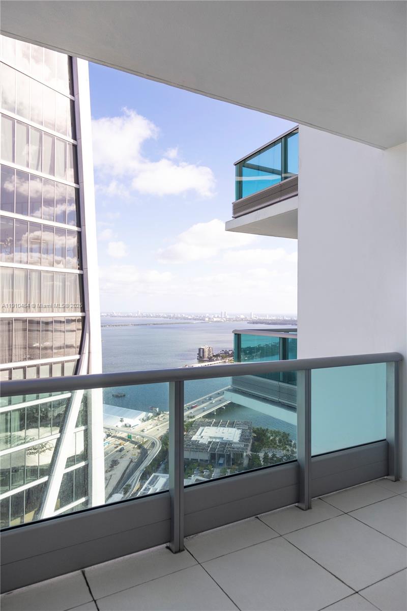 Beautiful 1-bedroom plus den converted into a spacious 2-bedroom, 2-bath condo on the 56th floor with breathtaking panoramic views of Biscayne Bay and Miami’s skyline. Features white glass tile floors, high ceilings, and floor-to-ceiling windows that fill the space with natural light. The kitchen is outfitted with Sub-Zero and Miele appliances and premium finishes. The primary suite includes a custom walk-in closet, spa-style bathroom, and access to one of two oversized balconies. Residents enjoy two resort-style pools, state-of-the-art fitness center, spa with steam, sauna, and jacuzzi, movie theater, club room, children’s playroom, concierge, and 24-hour valet. Cable and high-speed internet are included in maintenance. Ideally located in front of Bayfront Park and Perez Art Museum.