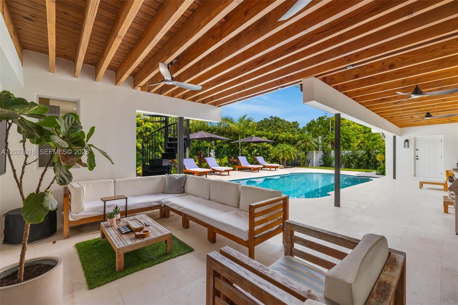 Stunning fully renovated four-bedroom, three-bath modern residence with a 2 car garage, offering the perfect blend of luxury, comfort, and indoor-outdoor living. This bright open-concept home has a total of 3,666 sq feet, a beautifully designed chef’s kitchen with high-end appliances, oversized island seating, and butler's pantry. Spacious living areas flow seamlessly into a private resort-style backyard complete with a luxurious swimming pool, expansive covered patio ideal for entertaining, and a rooftop deck perfect for panoramic sunset views and gatherings. 

Beyond its beauty, the home is designed for everyday comfort and functionality, featuring  a full-home gas generator capable of powering the air conditioning, refrigerator, and hot water heater.

Two bedrooms include walk-in closets, while the primary suite offers a true spa-inspired retreat. The primary bathroom features a freestanding soaking tub, oversized double walk-in shower, designer fixtures, and warm natural textures that create a calming, luxurious atmosphere. The oversized primary bathroom includes an adjoining extra room that can serve as an additional dressing room, secondary closet, office, gym, or flexible family space.

This thoughtfully designed property captures the essence of South Florida living by combining elegance, functionality, and resort-style ambiance in a private residential setting. 
Video - https://youtu.be/rnFMJ9ZVC_I?si=-z6sAQxnxWILErV9