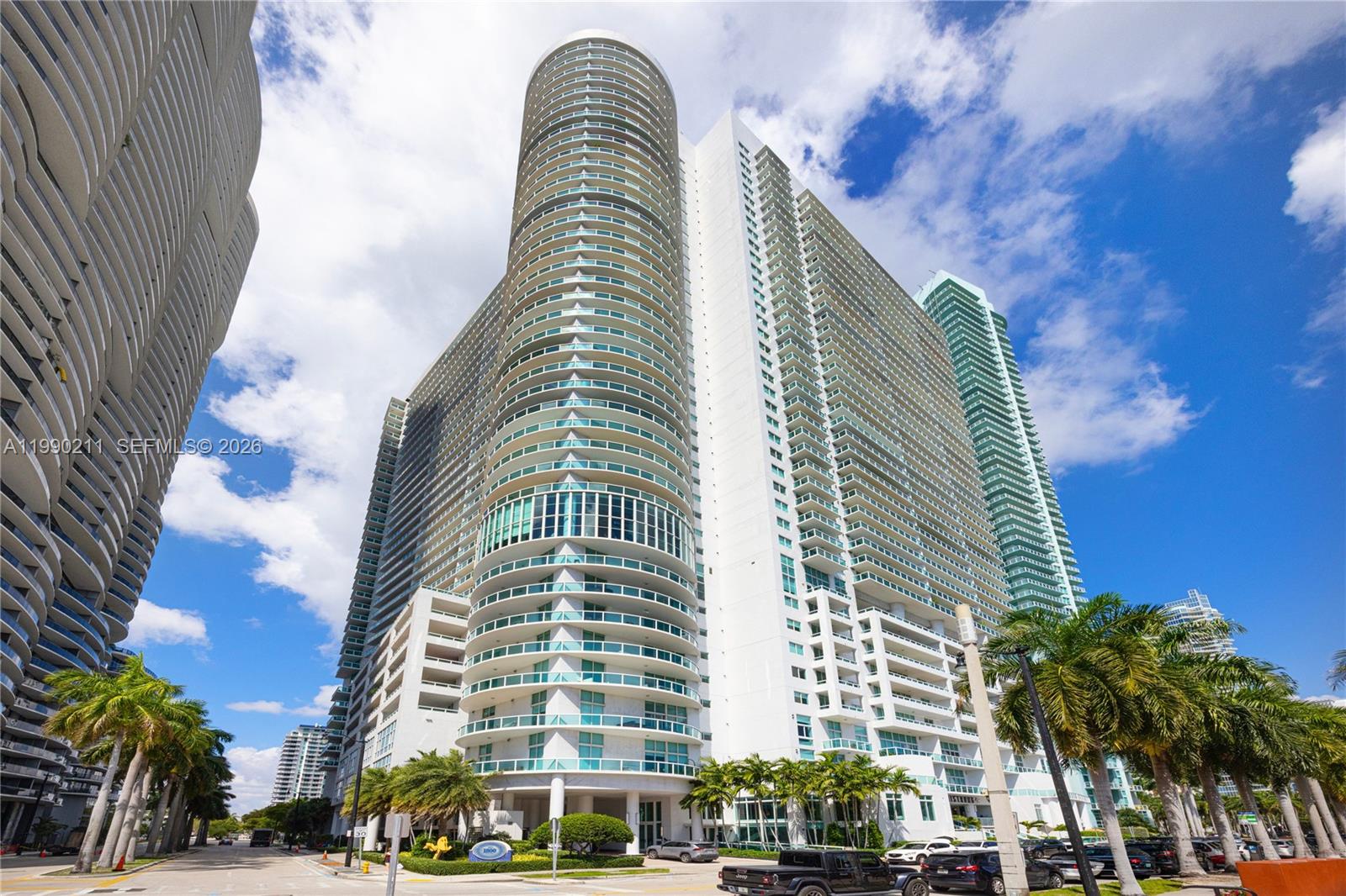 Residence on the coveted 01 line at the prestigious 1800 Club, currently the only 3-bedroom, 3-bathroom available in the building. This spacious apartment showcases permanent, unobstructed views of Biscayne Bay through floor-to-ceiling high-impact glass, filling the residence with abundant natural light. A spectacular wraparound balcony creates seamless indoor-outdoor living, while each bedroom features its own private balcony and en-suite bathroom. One of the few units with a storage room conveniently located on the same floor. The 1800 Club is an exceptionally well-managed building, further enhancing the value of this residence and its prime 01 line with protected bay views. The building is Fannie Mae approved, with strong financials, well-funded reserves, relatively low HOA fees, and fully operational amenities. Perfectly positioned in the heart of Edgewater, just minutes from fine dining, designer boutiques, Miami’s vibrant nightlife, and the city’s most sought-after destinations.