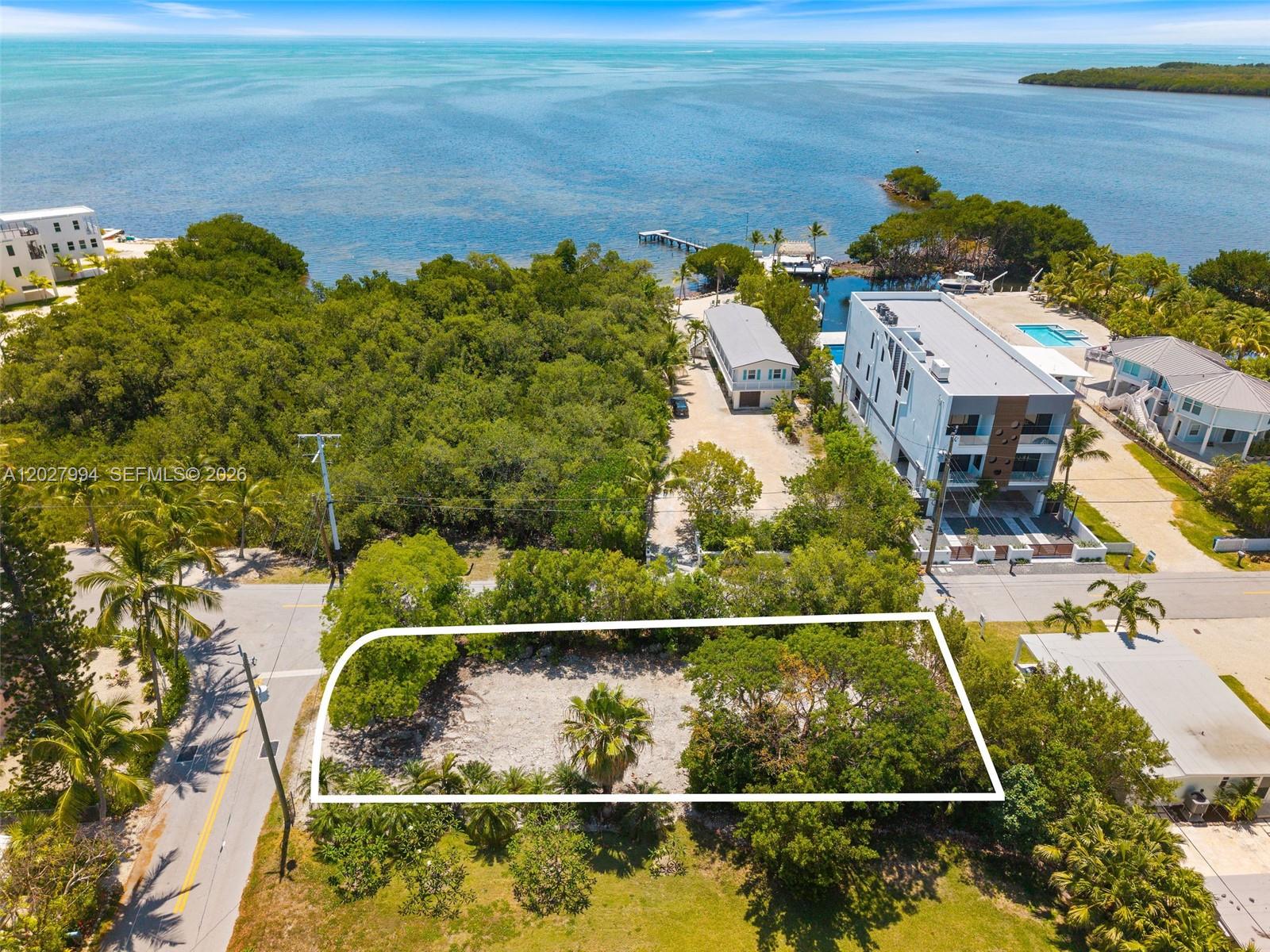 TIER 3, cleared oceanside lot in Key Largo! Build your dream home on this 50 x 125 cleared, corner lot in Key Largo! Desirable oceanside location in popular Seaside subdivision within walking distance to Snappers Oceanfront Restaurant and right across the highway from Mike Forester boat ramp and park. Submit your plans now and you'll be basking in the ocean breeze and beauty of island living before you know it! So many possibilities - make your vision come to life in the Florida Keys!