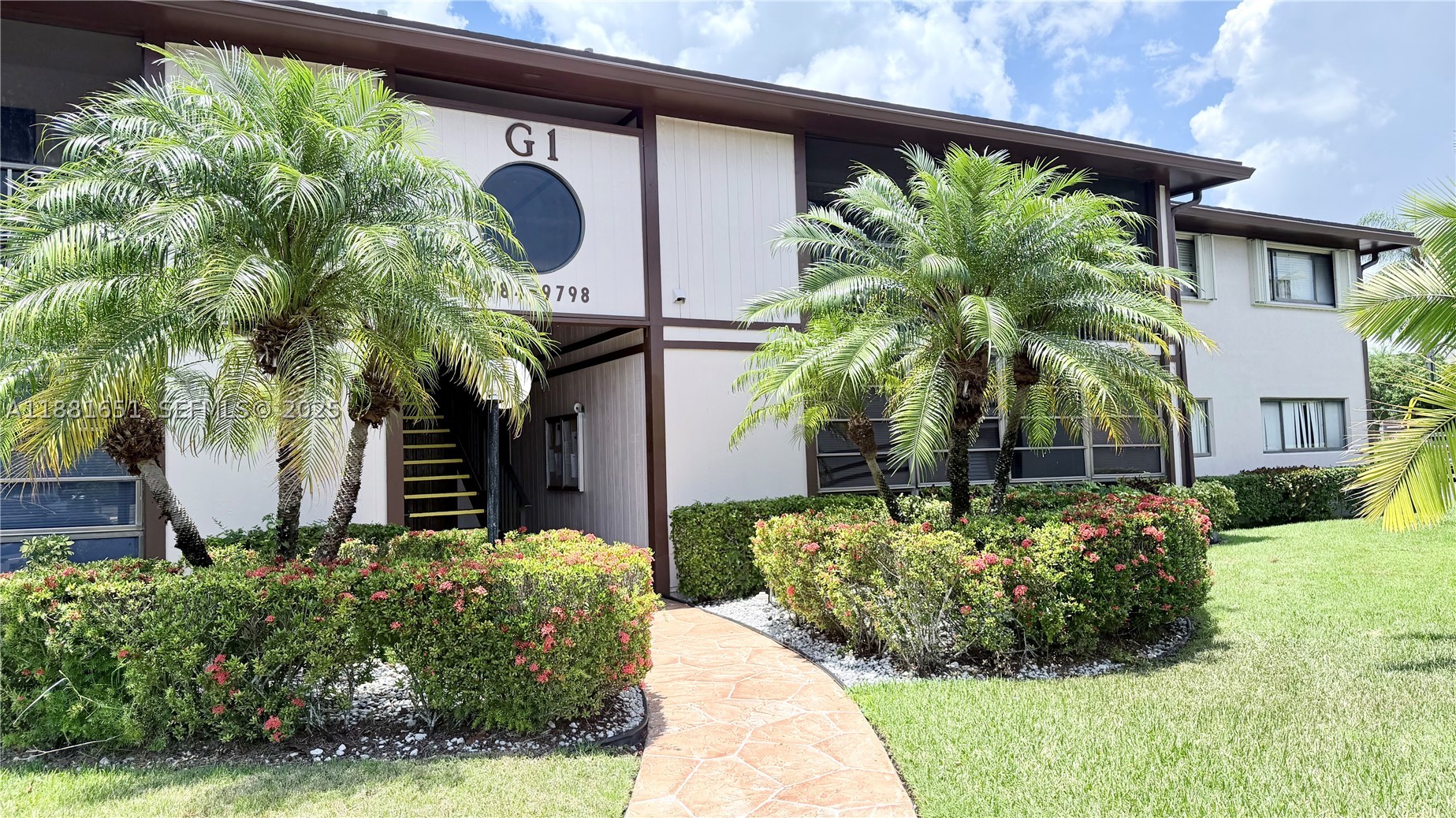 A MUST SEE!!! Well-Maintained and sought-after 55+ Community of Belfort, Kingspoint - in the heart of Tamarac. This spacious second floor condo offers 2 bedrooms / 2 bathrooms, featuring updated wood cabinetry and granite countertops in the kitchen. Enjoy the comforts of the all tiled and screened-in patio, perfect for morning coffee or evening breezes. Home also includes an in-unit full size washer and dryer with abundant storage space for convenience. Comfortable living in a quiet and friendly community that features; resort-style clubhouse, olympic sized pools, heated pools, fitness center, sauna, theatre, tennis and pickleball courts, bus services and many more club activities. Located close to Sawgrass Expressway, Tamarac Sportsplex, and easy access to shopping and dining.