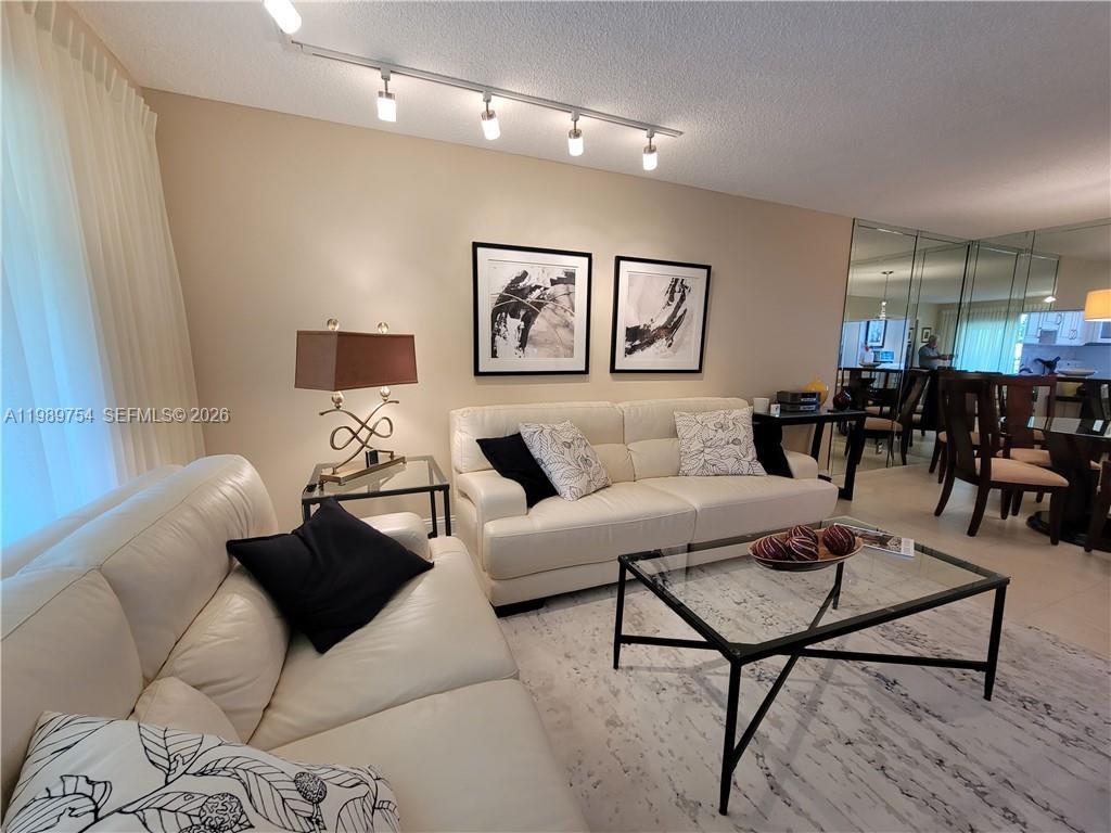 This apartment is definitely a gem with its two spacious bedrooms and two full bathrooms! Absolutely beautiful turn key unit. The best part? It's beautifully maintained. You can tell the owner takes pride in keeping this place looking nice and clean. Comes completely furnished as seen on the photos plus all the equipment in the kitchen. Unit has impact windows and shutters on the balcony side. Private screened porch. Porcelain floors, granite countertops and cabinets were installed in 2012. Seller has not occupied for the last 2 years. Maintenance fee includes cable TV, Wi-Fi, insurance, roof repairs, outside lawncare and so much more! Community represents itself as 55+.