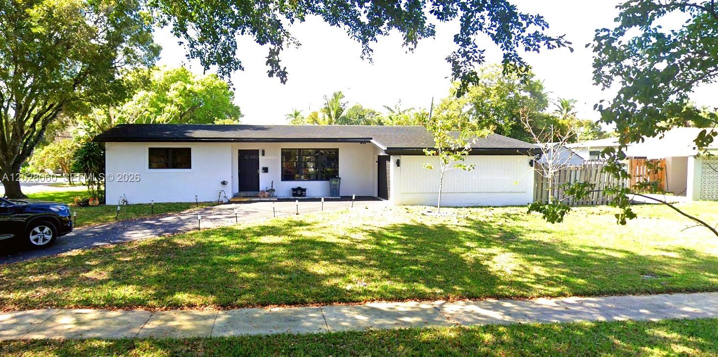 Charming open-concept home situated on an oversized corner lot with plenty of space to add a pool. Featuring a desirable split-bedroom floor plan, this home offers privacy and functionality, highlighted by a spacious primary suite. The expansive backyard is perfect for relaxing or entertaining, complete with a covered lanai and ample green space. Located on a quiet, quaint street in the heart of Plantation, you'll enjoy a peaceful neighborhood setting while remaining just minutes from major roadways, shopping, dining, parks, and everyday conveniences. Come see all this home has to offer!