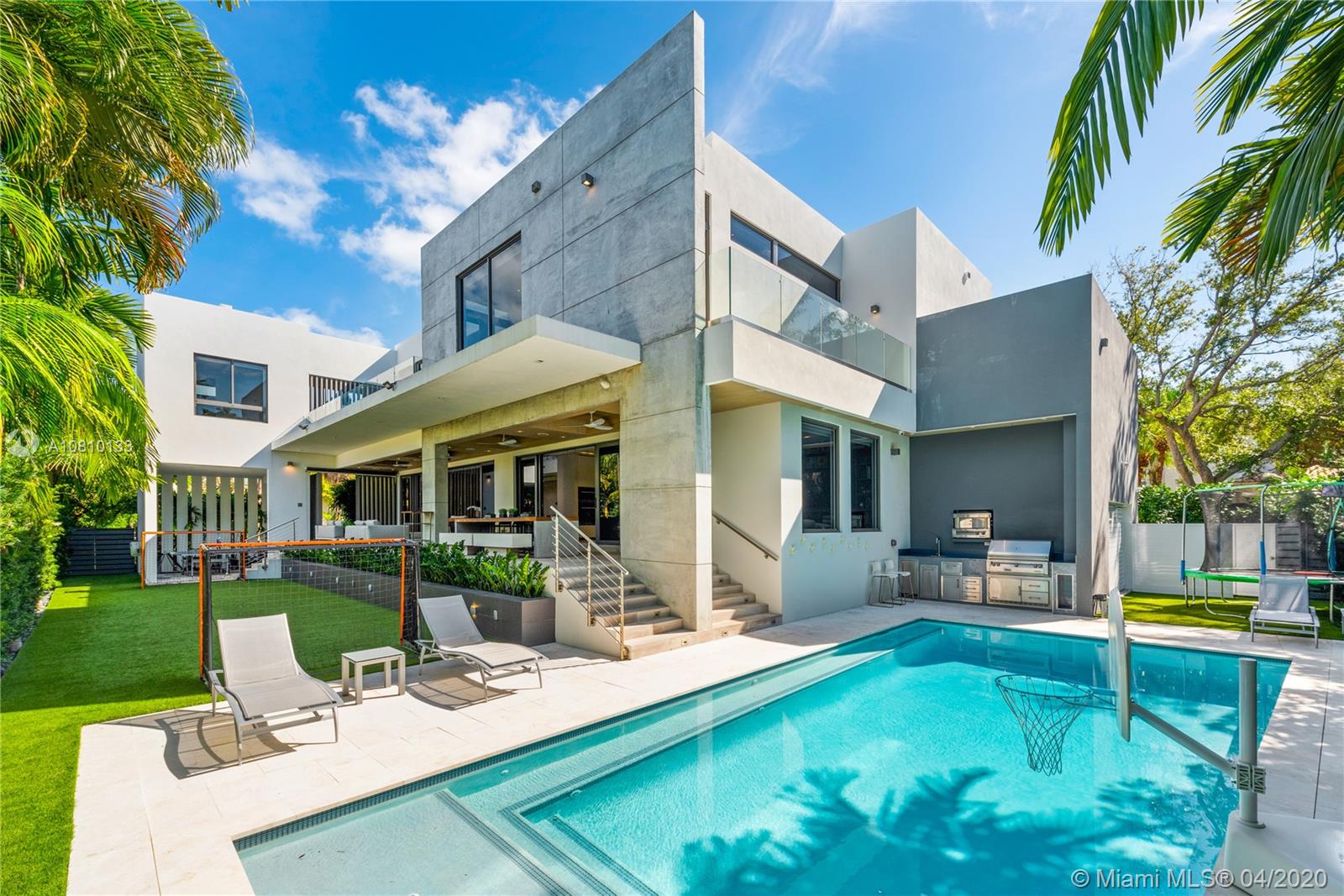 If you're looking for distinction in Key Biscayne, this masterpiece mansion is designed to perfection, and located in an oversized corner lot. Immeasurably superb and spacious 5,313 sq. ft. home featuring 6 BR-6.5 BA, including full staff & guest quarters & den. Take delight of the stunning interior with vaulted ceilings & ample natural light. Formal living/dining/bar area is integrated with large covered terrace overlooking the alluring pool, soccer field & putting green. The sensational Kitchen features Italian cabinets, Miele appliances, wine cooler, XL eat-in island & family room. Wake up in the luxury Master Suite which includes dual sinks, rain vapor showers, 2 walk-in closets & balconies. Appreciate the exquisite details, smart technology and the highest-quality finishes throughout!