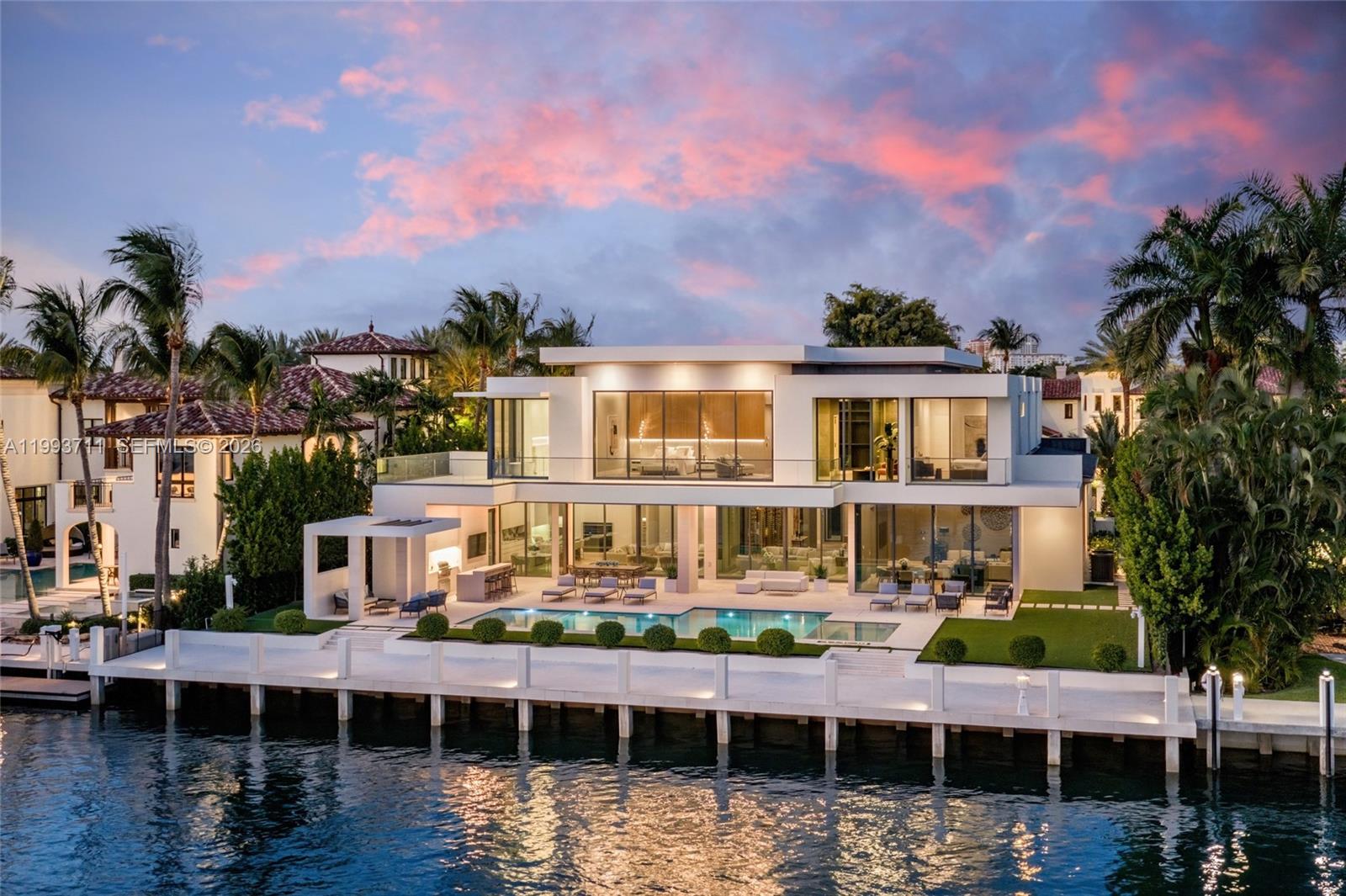 Set behind the gates of Harbor Beach, one of Ft Lauderdale’s most prestigious waterfront enclaves, this exceptional estate embodies a level of scale, privacy, and design rarely brought to market. Commanding 110 ft of deep-water frontage on a wide turning basin, the residence offers sweeping views and seamless yacht access with no fixed bridges, a setting as functional as it is striking.

Built by Sarkela Corp, the residence spans 8,725 square feet of interior living and 10,548 total square feet, offering 6 bedrooms, 7 full bathrooms, and 2 half baths - thoughtfully composed to balance grand entertaining and refined daily living. Designed by Randall Stofft with interiors by Italian D-Editors, the home is defined by expansive open spaces, walls of glass, and a seamless indoor-outdoor flow, fully embracing its waterfront position.

A chef’s kitchen with a dedicated prep area, formal dining room, and sophisticated club and media room create a polished yet effortless living experience. The primary suite is designed as a private retreat, complete with dual spa-caliber baths and custom wardrobes.

Outdoors, a resort-style pool and generous waterfront terrace unfold along the water’s edge, offering a setting that is both serene and connected to the yachting lifestyle synonymous with Harbor Beach. Located within the Surf Club community, with access to a private marina and beach club, this is a distinguished offering within one of South Florida’s most coveted waterfront addresses.