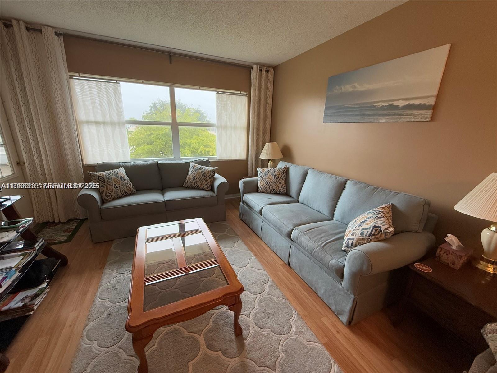 TURN-KEY FURNISHED 1 bed/1 bath located in the 55+ community of Lauderhill East. This building has elevator and is located on the top floor, therefore no upstairs neighbor. All windows are hurricane impact and front door was replaced last year. 40th year inspection has been done and there are no special assessments. Bathroom has access from both the bedroom and hallway area. Living room is equipped with a pull out couch and leads to the enclosed Florida room. Both living room area and balcony have a garden view overlooking the clubhouse. Additional locker and laundry room are located on the same floor. Water heater is from 2022 and parking number is #62. Rentals after 1 year, 2x per year (7 months max, no yearly)