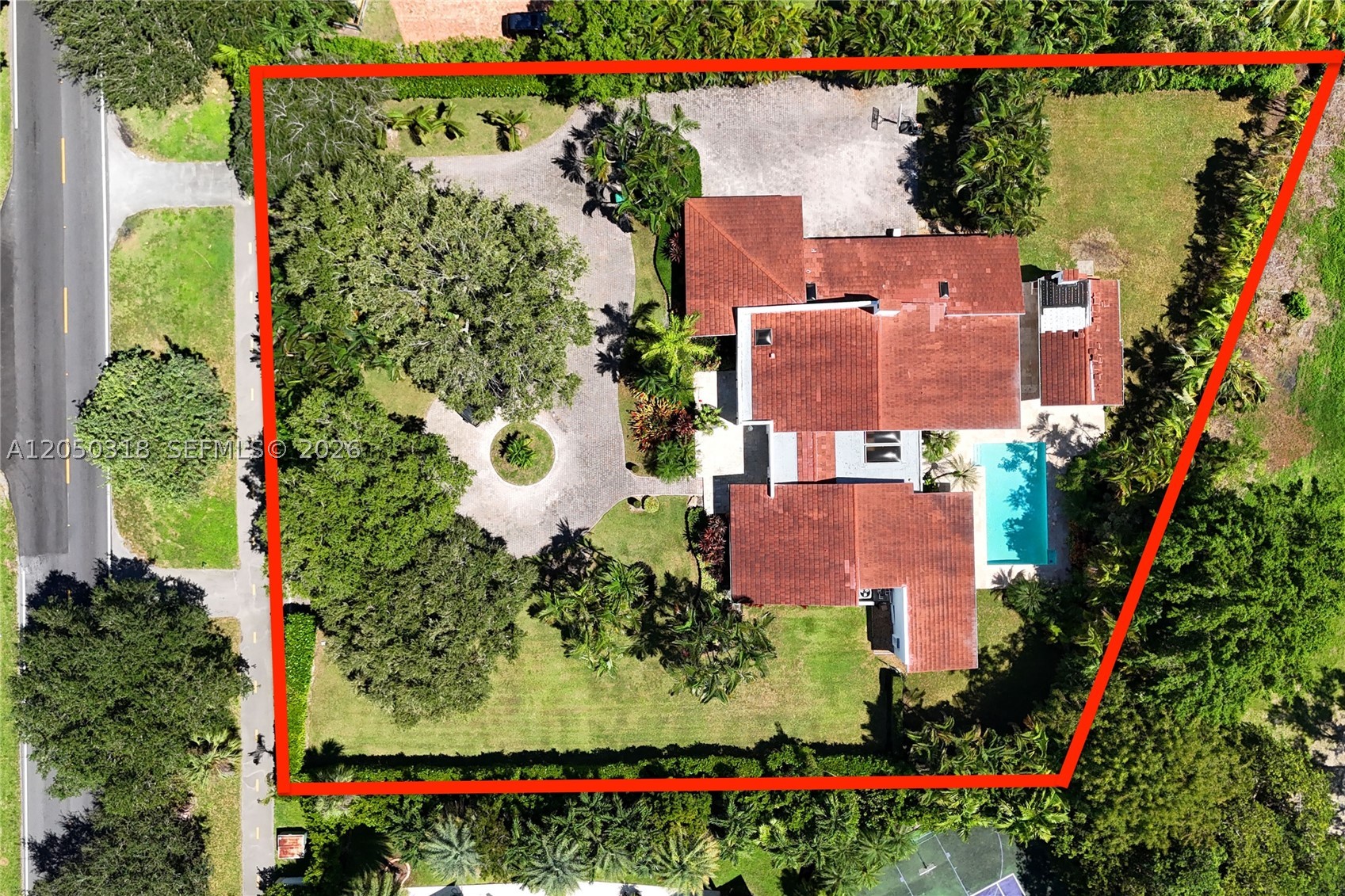 Located on a gracious 39,493 square foot lot in the prestigious South Gables this lovely home has been thoughtfully updated and is ready to be expanded or rebuilt! The 3,917 square foot home is set back from the street and features 5 bedrooms, 4.5 bathrooms, office, and gourmet kitchen with high-end appliances. The flexible floorplan offers generous living spaces in the living room, dining room, and family room overlooking the pool. Situated privately to one side of the house, the primary bedroom includes a new, spa-like bathroom and oversized closet. The home features a 2 car garage, laundry room, impact glass windows and doors, and a large covered patio. This is a prime opportunity!