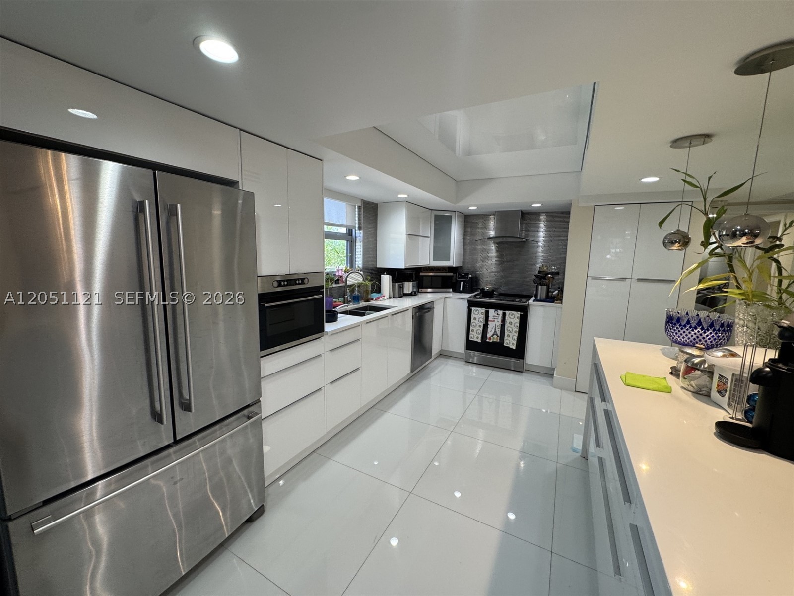 I'm Excited About This Property! .... Now Let Me Tell You Why! .... 1,557sf, 2/2, Fully Remodeled,  Impact Door & Windows, Stretch Ceilings, Porcelain White Floors Throughout, HOA: $2,130/mo,   1 assigned parking space + 1 guest parking space.  , HUGE Private Terrace Good For A SUKAH!