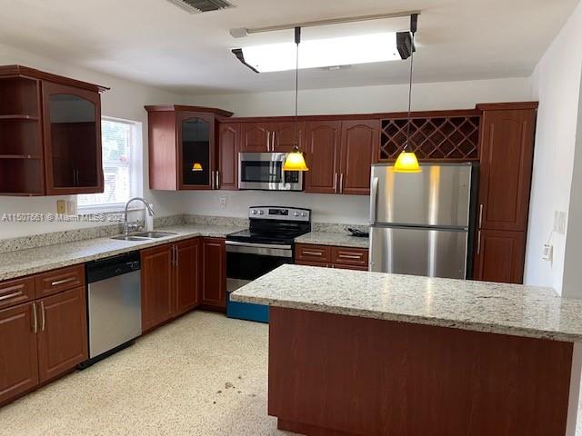 Spacious corner tri-level home with pool and partial basement, granite countertops, new roof less than 2 years old