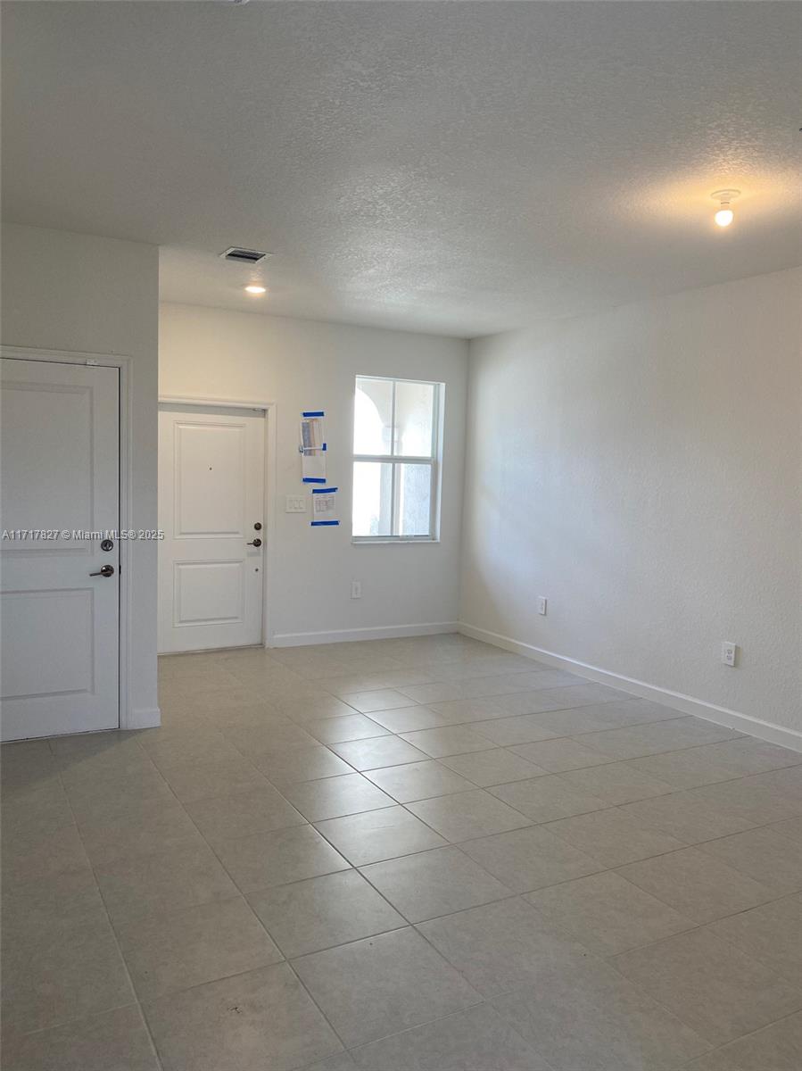 Located in north Miami, FL, Westview is a masterplan community of new homes and townhomes with pristine lake views and lush green areas. IDEALLY FOR INVESTORS. LEASE CAN BE TERMINATED WITH 60 DAY NOTICE. Amenities include swimming pool, hot tub, fitness center with state-of-the-art equipment, clubhouse, and tot lot. Gated community with 24/7 security. A serene pond will add to the natural splendor of the community. This new 2-story TH is a family-friendly haven. The first floor showcases a combination living and dining room, a modern kitchen and a Great Room that opens onto a patio for sunrise coffee and starlight suppers. Upstairs are two restful secondary bedrooms and a lavish owner’s suite featuring a coffered ceiling, spa-inspired bathroom and walk-in closet. RENTED until July 31 2025.