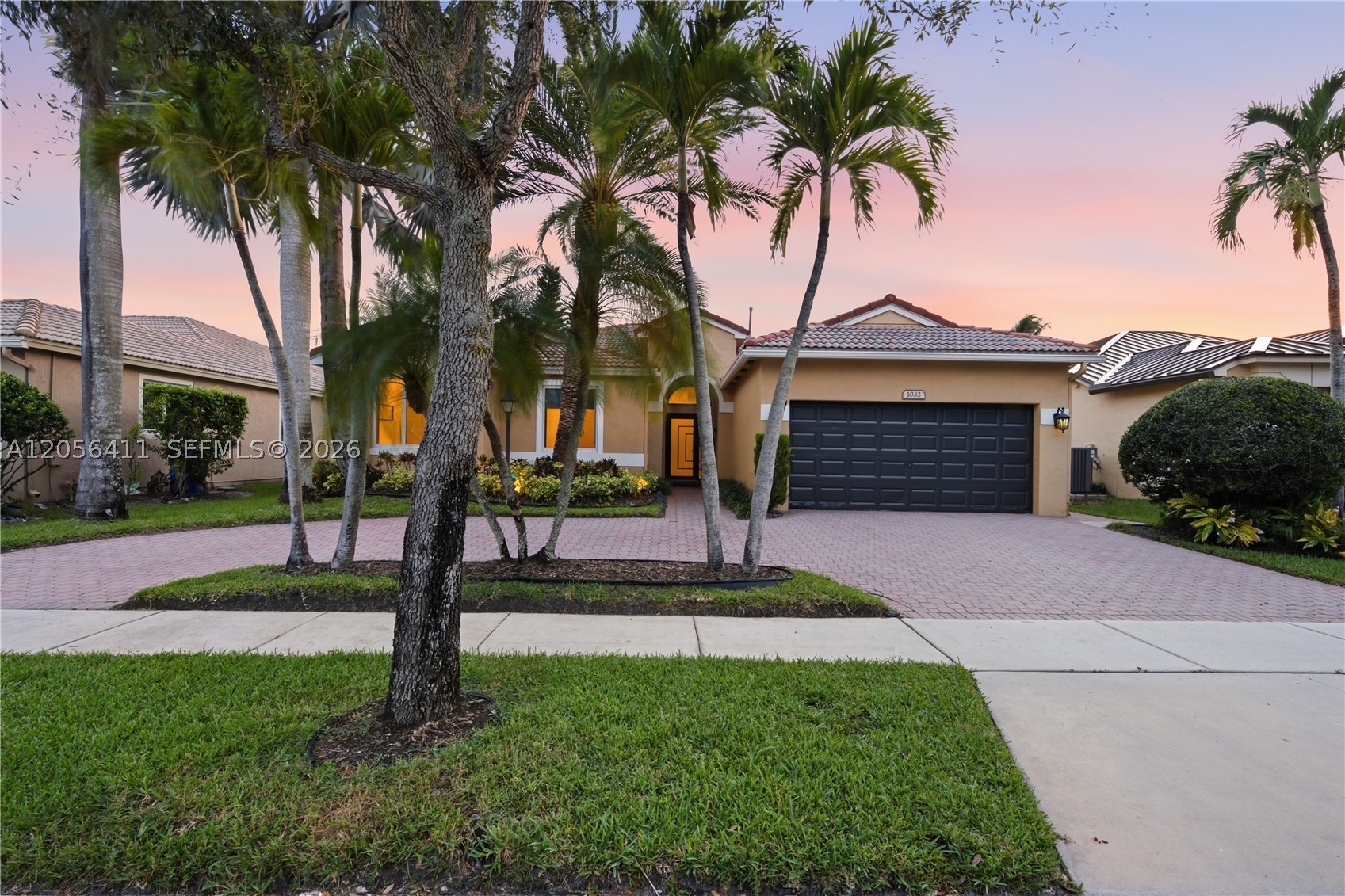 Sought-after Newport model featuring 3 BEDROOMS + AN OFFICE, 3 FULL BATHROOMS, A 2-CAR GARAGE, & A CIRCULAR DRIVEWAY. This beautifully appointed home features IMPACT WINDOWS & DOORS THROUGHOUT and elegant TRAVERTINE FLOORING throughout the main living areas. The UPGRADED KITCHEN is designed for both style and functionality with GRANITE COUNTERTOPS, A WATERFALL EDGE PENINSULA, REAL WOOD CABINETRY, & STAINLESS-STEEL APPLIANCES, all opening to the family room. The SPACIOUS PRIMARY SUITE offers TWO WALK-IN CLOSETS WITH PREMIUM CUSTOM ORGANIZERS, while the UPDATED BATHROOMS are finished with granite countertops. Step outside to an EXTENDED COVERED PATIO OVERLOOKING SWEEPING LAKE VIEWS and a generously sized backyard with plenty of room to add a pool, creating the perfect space to relax or entertain. Pembroke Falls is a RESORT STYLE GATED COMMUNITY with a STATE-OF-THE-ART CLUBHOUSE that features a pool, tennis courts, pickleball courts, basketball courts, gym, and more! The community also offers NATURAL GAS to its residents. The HOA includes Cable, Fiber Optic Internet, Alarm System, 24-hour security, AND SO MUCH MORE!