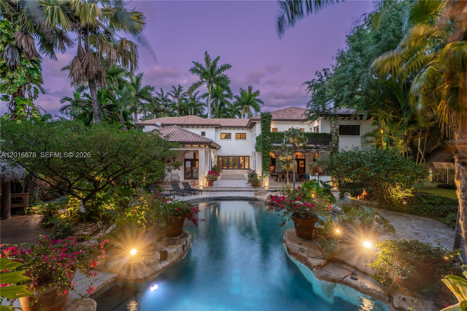 Positioned on a prime one-acre lot along iconic Old Cutler Road, this exceptional transitional estate offers a rare blend of scale, privacy, and timeless elegance in one of Ponce Davis’ most coveted residential corridors. Featuring 5 bedrooms plus an office, 4.5 bathrooms, 6,045 SF of interior living space, and 7,885 SF of total area, the residence is designed for both refined everyday living and effortless entertaining.
Soaring ceilings, expansive living spaces, and a thoughtful floor plan create seamless flow throughout the home, while abundant natural light enhances its warm and sophisticated character. Outdoors, lush landscaped grounds set the stage for a true resort-style experience with a private pool, hot tub, jacuzzi, and a 3-car garage. Combining generous proportions with a premier location, this is a rare opportunity to own an exceptional estate property moments from the best of Coral Gables, top schools, and premier dining and shopping.