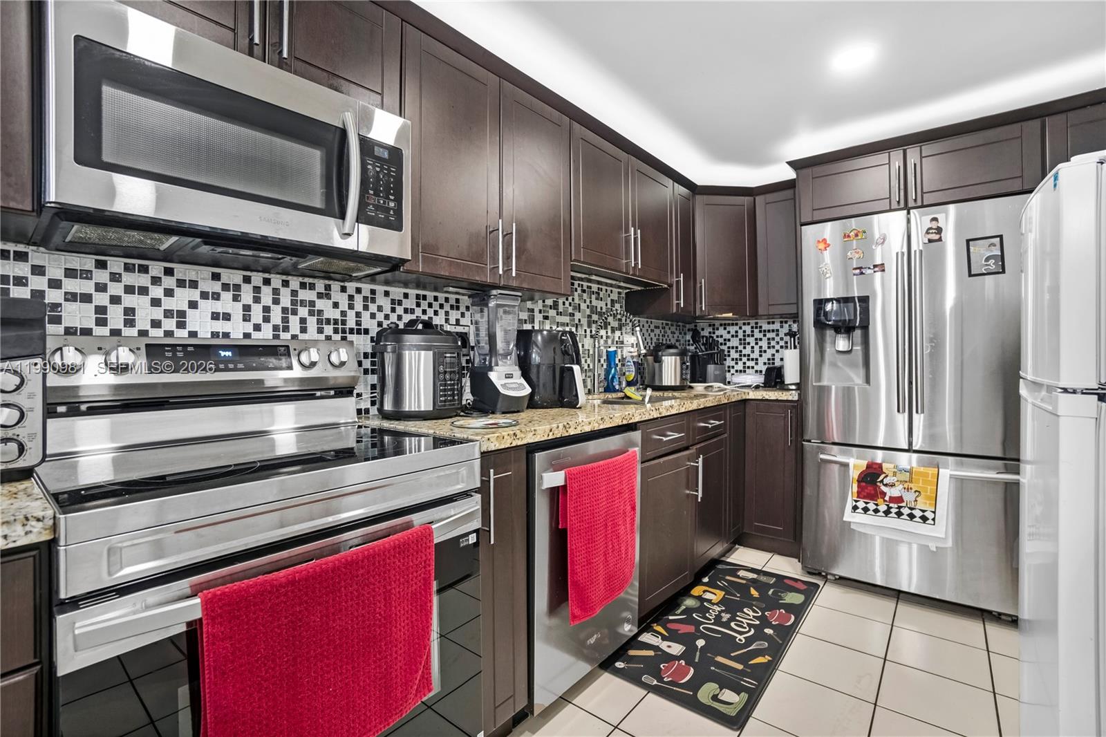 Spacious well maintained first-floor condo in highly desirable location. Features stainless steel appliances, grannie countertops, and a functional layout designed for comfortable living. Convenient first floor access makes daily living easy, and the property is ideally located near shopping, dining, and major roadways. HOA includes water and 40 and 50 year inspection pass. Excellent opportunity to own in a great area or investor opportunity in a prime highly desire location.