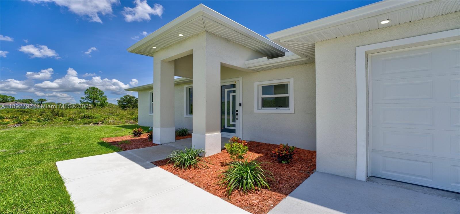 Brand new construction ready to move in! This beautiful 3-bedroom, 2-bath home features a modern open-concept layout with high ceilings that enhance the sense of space and natural light. The property showcases a contemporary front entrance that adds great curb appeal. Enjoy tile flooring throughout for durability and easy maintenance. Impact-resistant windows and doors provide added security and energy efficiency. The home also includes a one-car garage and a backyard, ideal for outdoor activities or future improvements. With 1,169 square feet of well-designed living space, this home offers the perfect blend of style, comfort, and functionality in the growing area of Lehigh Acres.