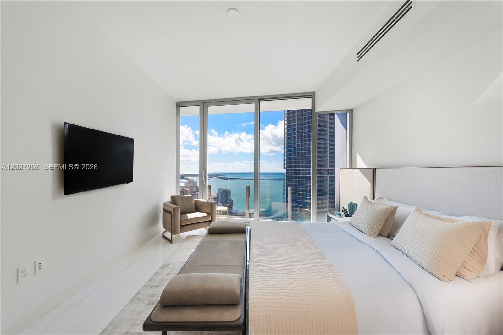 Luxury Furnished by Artefacto & Restoration Hardware.

Experience elevated waterfront living in one of Miami’s most prestigious & sought-after addresses. This fully upgraded, professionally designed residence is move-in ready & offers an exceptional combination of elegance, comfort & iconic design.

Spacious unit featuring two bedrooms with direct bay views, while the den has been thoughtfully converted into a third bedroom complete with a full bath & closet. Or can be a private office. Enjoy breathtaking southern exposure from the expansive waterfront terrace with views of Biscayne Bay. The residence showcases soaring ceilings, floor-to-ceiling glass, a kitchen with premium Gaggenau appliances, luxurious spa-inspired bathrooms finished in marble floors & walls, creating a five-star hotel ambiance.

The primary suite offers double vanity, oversized wet room (soaking tub & rain shower), and three generous closets. Laundry room with washer and dryer.

Residents have +42,000 square feet of world-class amenities spanning four entire floors, including:

* Sky Pool Deck on the 55nd floor
* State-of-the-art fitness center across two levels
* Full-service spa/wellness facilities
* Private movie theater
* Golf simulator
* Boxing and spinning studios
* Beauty salon/ barber shop
* Yacht marina

A rare opportunity to own a turnkey residence in Miami’s most iconic luxury tower, where exceptional design, unmatched amenities, and premier waterfront living come together