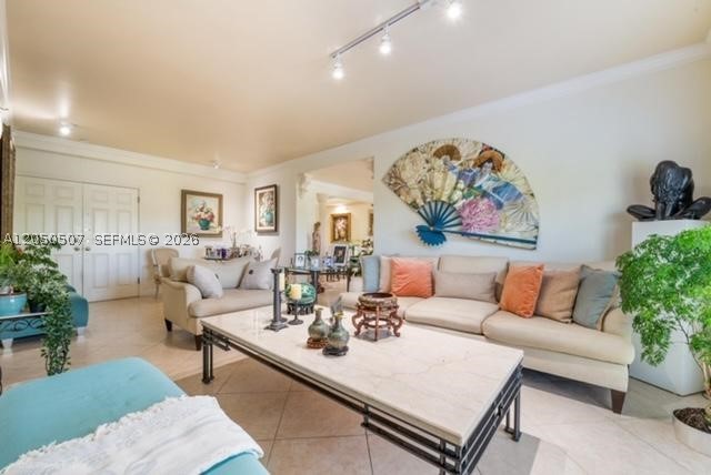 EXCELLENT LOCATION! Bright and spacious unit with impact doors and windows and four East-facing balconies has two master suites at opposite ends, plus a 3rd bedroom. Each master has walk-in closets and balcony. One master has two bathrooms. Unit was planned as two and joined together during construction. Secured building has party room with expansive outdoor terraces, gym and pool. Walking distance to free CG Trolley stop, Target and Publix; Miracle Mile is 10 blocks south. Two assigned parking spaces in secured garage. Low HOA fee! Offered partially furnished. Selling AS-IS. Easy to show!