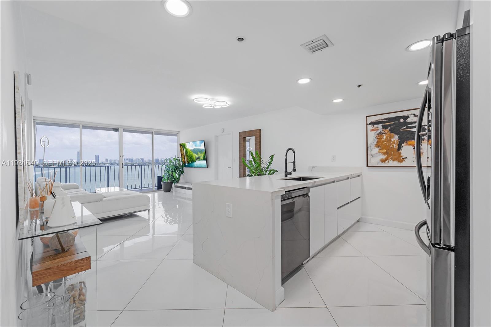 Fully remodeled 2-bedroom, 2-bath residence featuring spectacular, unobstructed bay and marina views in North Bay Village. The unit offers brand-new appliances and an expansive balcony, perfect for relaxing and enjoying morning sunrises with coffee or unwinding in the evening while taking in sparkling city lights and boats cruising by.