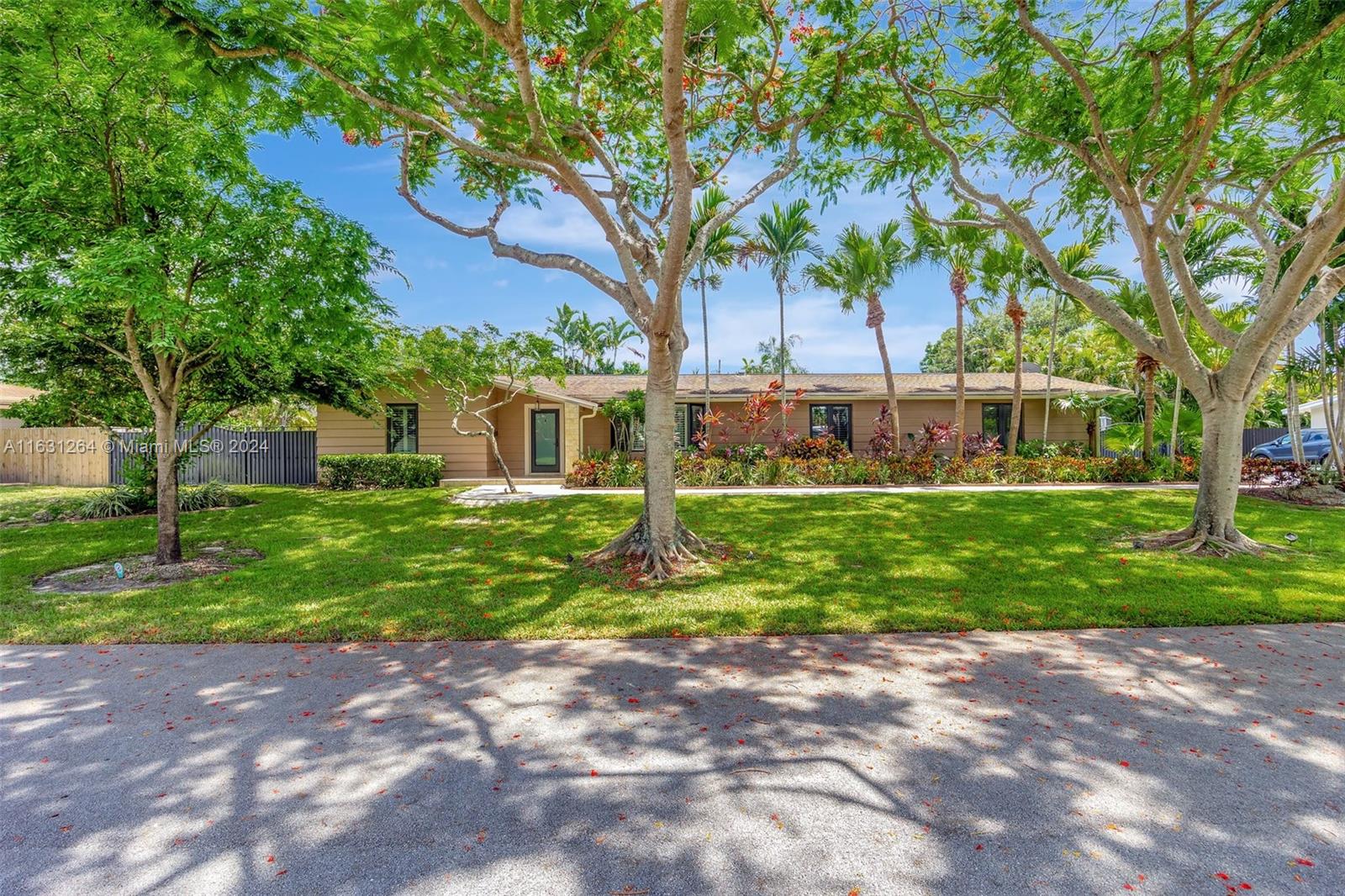Beautiful and completely renovated Palmetto Bay 3 bedroom plus den/office screened pool home on a fabulous and well kept street with lush landscaping and fruit trees. Impact windows and doors, Viking appliances, gourmet kitchen with custom cabinets and granite countertops, custom closets, porcelain tile floors and recessed LED lighting throughout. Pool has a salt water system. Sliding doors recess completely, opening up the house to the pool/patio for true Florida living. Plantation shutters and shades. Two tankless on demand water heaters. Spa like features in bathrooms including rain shower, massage jets, jacuzzi tub and towel warmer. Septic lines replaced in 2014.  A must see - your buyers will fall in love with this home!!