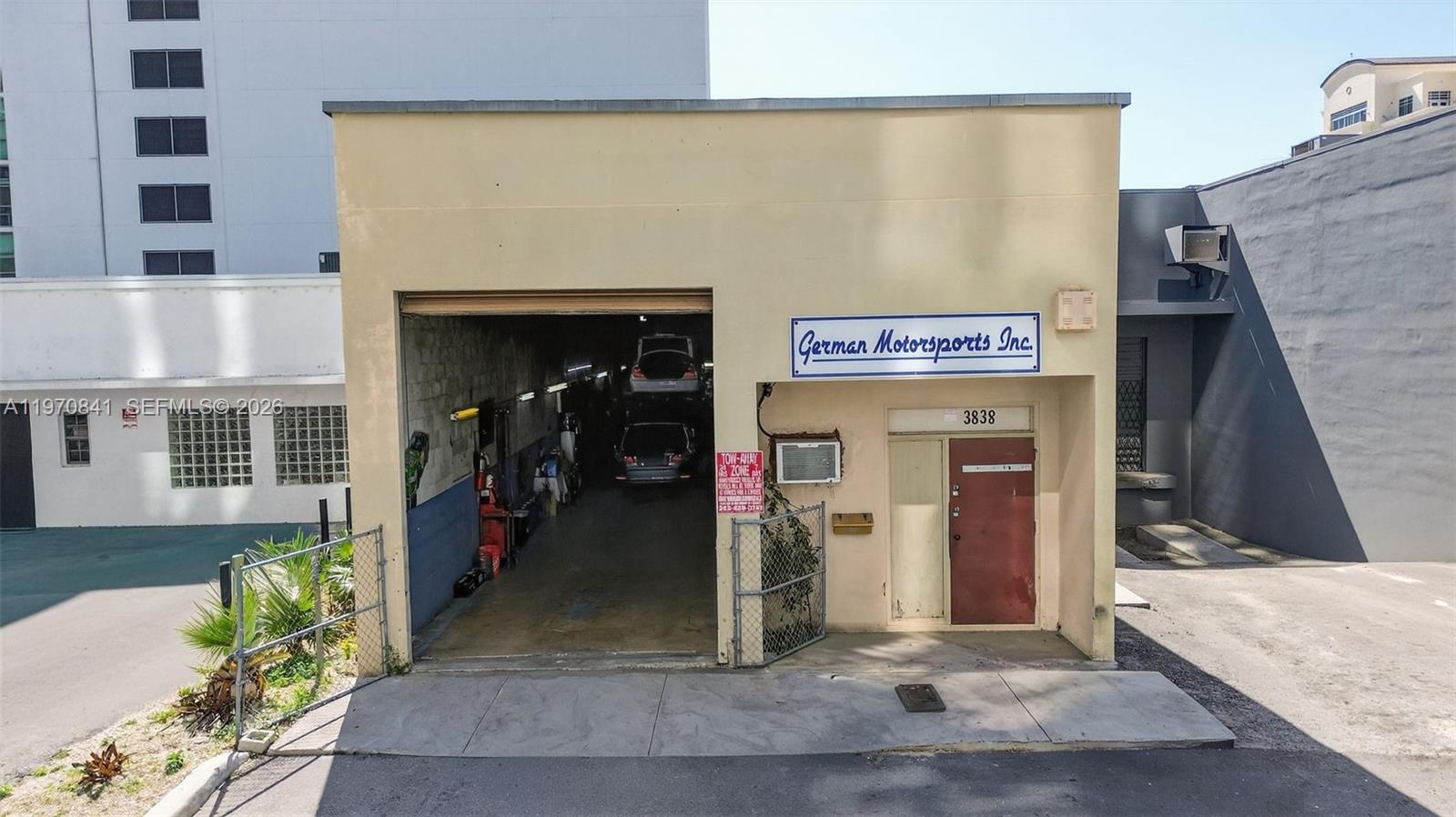 Prime opportunity in the Coral Gables Warehouse District just minutes from Coconut Grove and only one block from US 1 with excellent accessibility and strong visibility. This warehouse features approximately 25 to 27 foot ceiling height, providing outstanding vertical space for storage or equipment. Currently operating as a fully functional mechanic business with an established client base, the property offers immediate income potential. Equipped with three car lifts inside, the space is ideal for automotive use, light industrial, or service oriented businesses seeking a strategic Miami location.