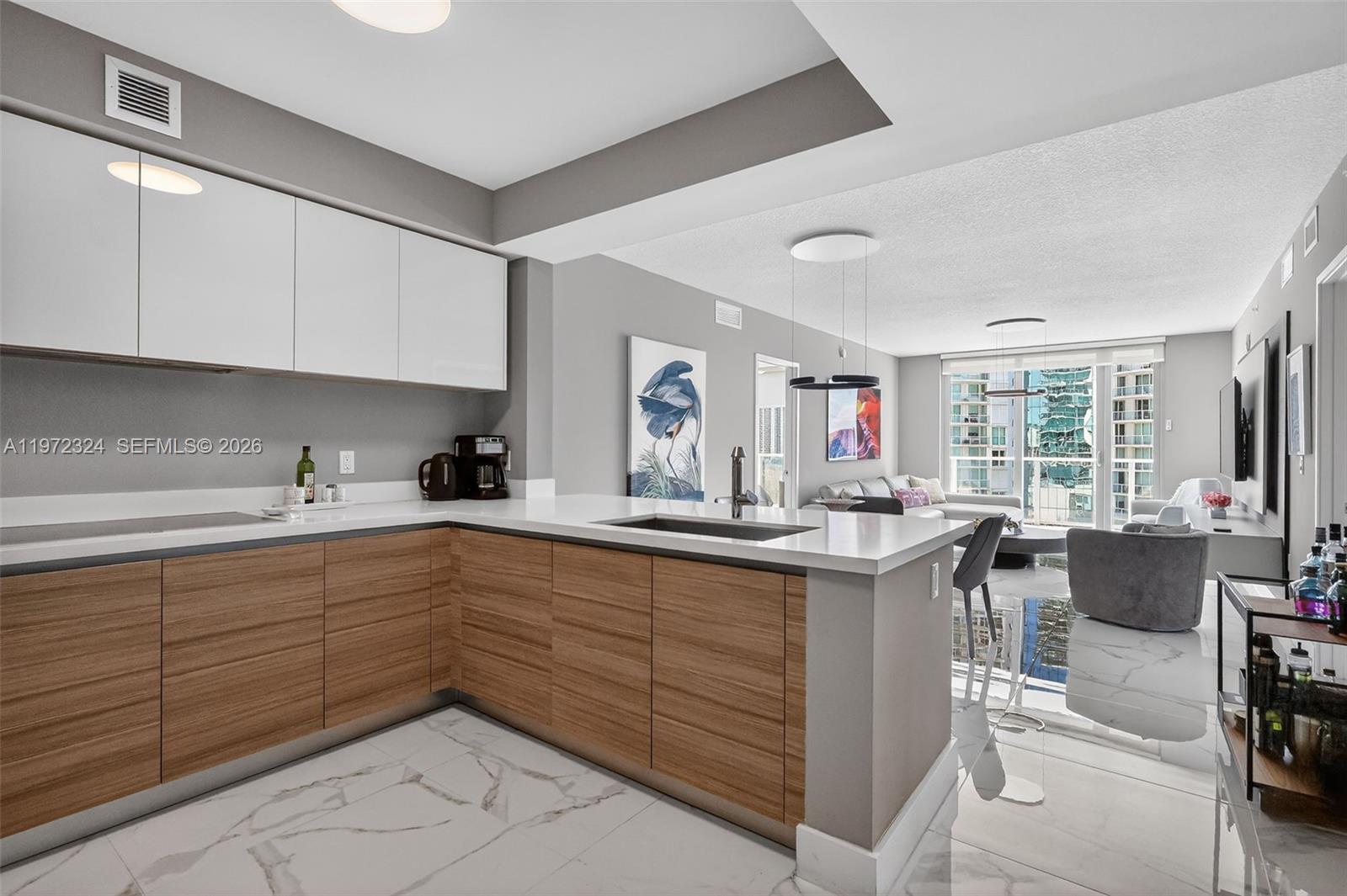Wow! Welcome To This Luxurious Contemporary Masterpiece In Parque Towers Located In The Heart Of Sunny Isles Beach.  Enjoy Spectacular Views Of The Bay, Intracoastal And City From Oversized Wraparound Terrace And Floor To Ceiling Impact Glass Windows in this 3 Bed/ 3 Bath (3rd Bedroom is a Den with Ensuite Bathroom and Closet)! Finest Finishes Include Shining Light Porcelain Floors Throughout Entire Residence, Open State Of The Art Gourmet Kitchen With Italian Cabinetry + Top Of The Line Appliances  And So Much More!  This Exclusive Building Offers 5 Star Resort Style Amenities Including 3 Pools, Fitness Center, Spa, Sauna, Movie Theater, Indoor Children Playroom, Business Center, 24 Hour Concierge Service, Valet Parking And More.