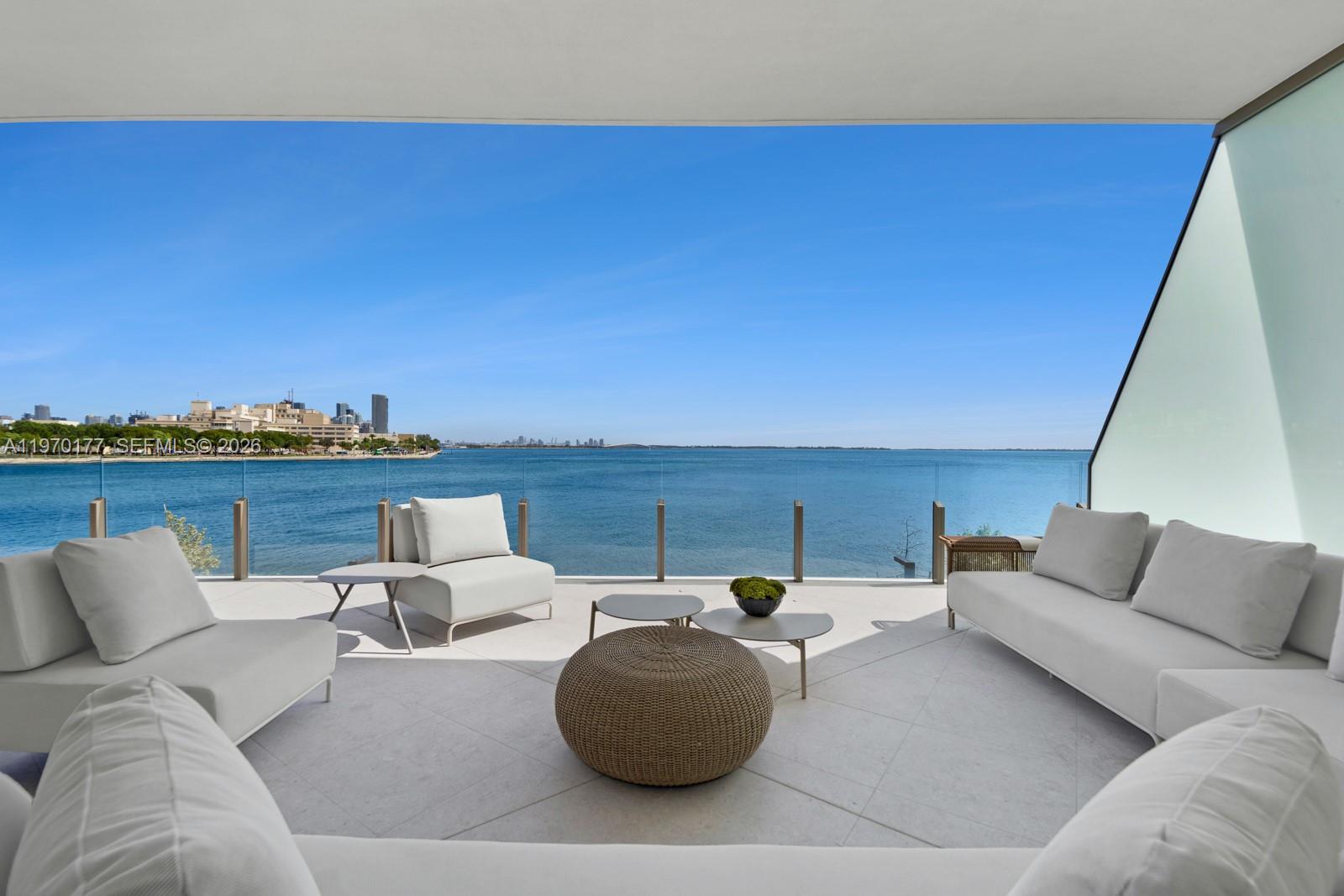 Experience elevated Waterfront living at Vita at Grove Isle, an exclusive residential masterpiece by renowned developer Ugo Colombo, set on a private 20-acre island just off Coconut Grove. This exceptional residence offers 3,610 SF of interior living plus 1,437 SF of expansive terraces, including a 13’5” deep outdoor space, steps from the ocean. A private elevator opens directly into the home—one of only 65 uniquely designed residences in this green-certified building. Open-concept kitchens by Molteni, spa-like baths with Italian stonework, steam showers, and fixtures by Dornbracht. Pre-installed Crestron and Lutron HomeWorks systems. World-class amenities include membership to the Grove Isle Racquet & Yacht Club, tennis and pickleball courts, a full-service wellness spa and fitness center, concierge services, children’s playground, and poolside bar. Waterfront dining operated by Daniel’s Miami completes the experience—private island living at its finest. Includes one private garage. BEST UNIT AVAILABLE!