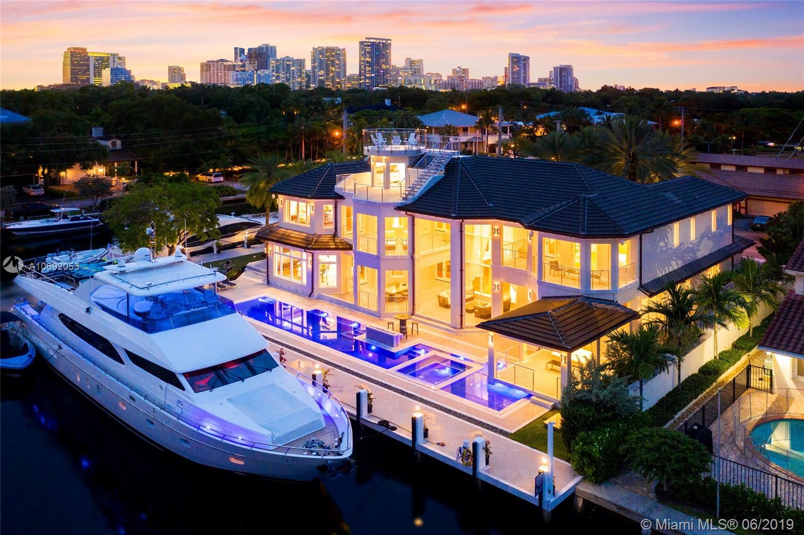 Masterfully designed Modern West Indies legacy estate on a spacious point lot in the highly desirable Rio Vista Isles. Custom finishes throughout with exquisite attention to detail for luxury living from walk-in wine cellar, home automation system, executive office, gentleman's quarters, 4 car garage, gourmet kitchen and deep balconies. This extravagant boaters’ dream home features 250 feet of deep water frontage with space for two large yachts, wide water views and rotating observation deck on top for the best panoramic views in Fort Lauderdale. A once-in-a-lifetime home.