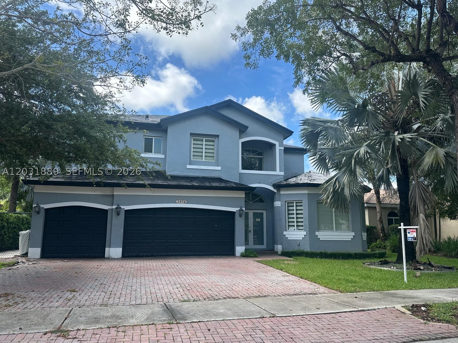SPACIOUS PALM ISLES ESTATE HOME WITH GOLF VIEWS. This 5-bedroom, 3-bathroom home with a 4-car garage is situated on a premium lot with scenic views of the Golf Course. The home features a split open floor plan with a large great room that opens to the kitchen, breakfast area, and family room. The kitchen offers granite countertops, and tile flooring is located throughout the living areas. The spacious primary suite includes dual vanities, a separate shower, and a soaking tub. The fenced backyard provides added privacy. Located in a gated community with tennis and pickleball courts. Sold As-Is Cash only due to condition.