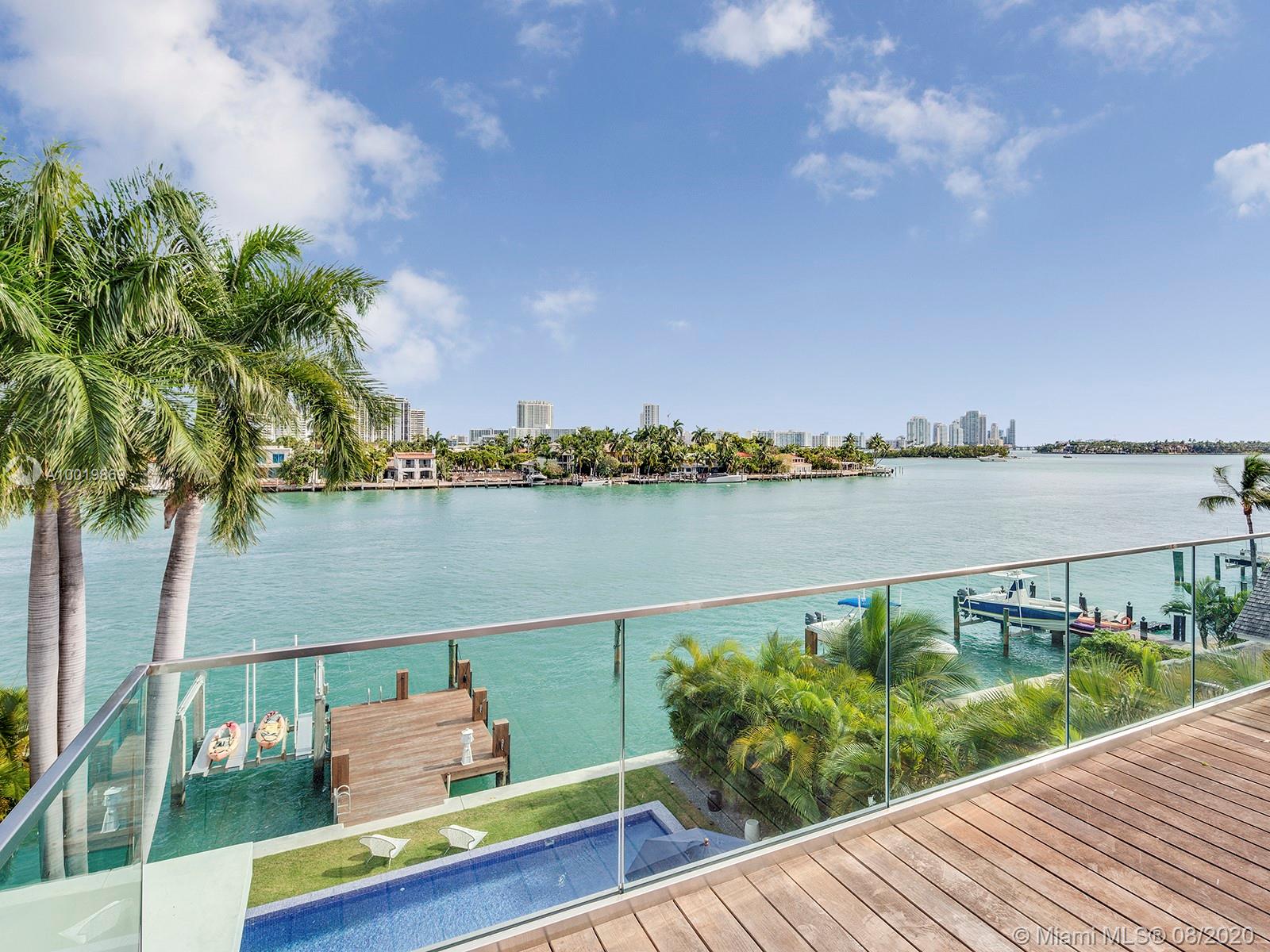 Stunning tropical modern home with large telescopic sliding doors at rear which create indoor outdoor living. Spacious 4 bed and 4.5 baths with soaring double height ceilings at entrance, custom marble and oak flooring, luminous natural lighting. A large roof terrace offers you 360 degree water and city views. Over-sized rear yard with huge pool, gazebo, outdoor summer kitchen and ten person Jacuzzi.