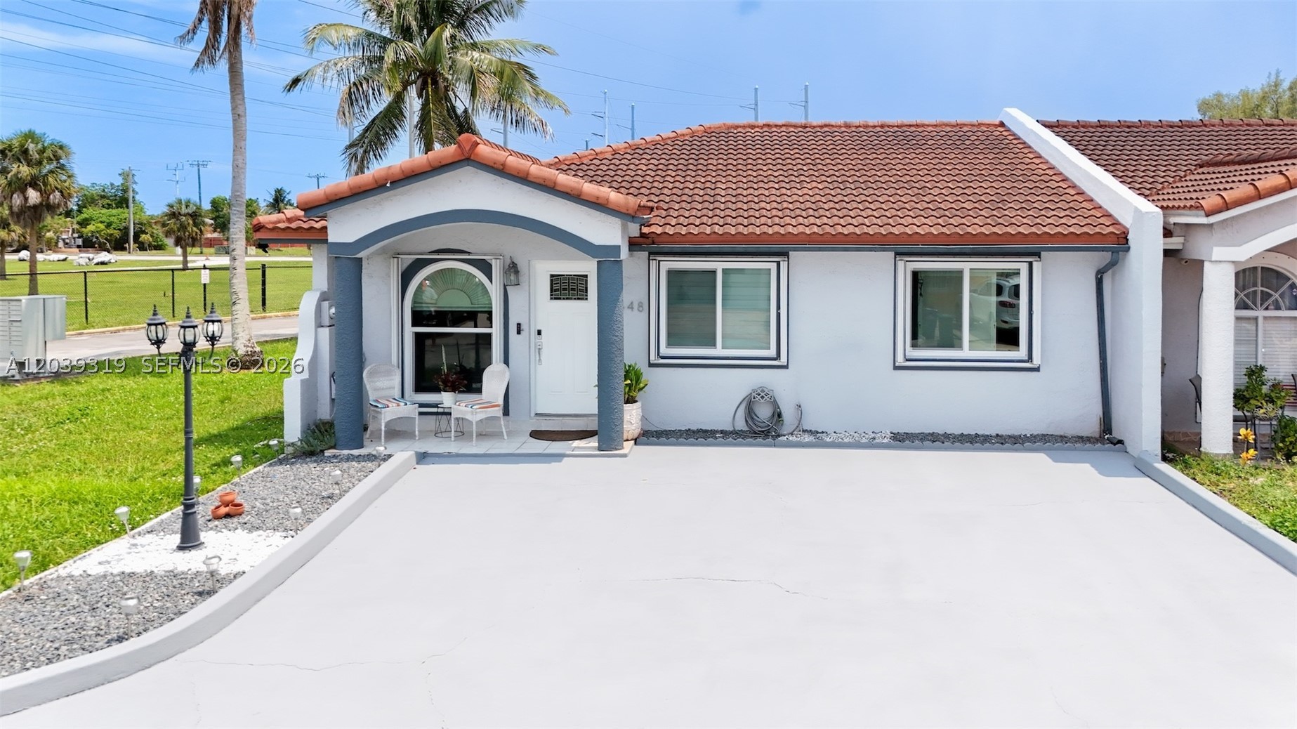 Rarely available corner villa-townhome in the heart of Country Club between Miami Lakes and Palm Springs North.  Desirable location with only one adjoining neighbor, no rear neighbors, and additional privacy along one side of the property. **NEW ROOF**IMPACT WINDOWS** and accordion shutters provide added value and storm protection **VERY LOW HOA FEE**  This one-story home features tile flooring throughout and a neutral color palette. High-end zebra-style window shades are installed throughout the home. Remodeled kitchen features granite countertops, top-of-the-line cooktop, and an oversized island. Both bathrooms have been renovated, and the primary suite includes a spacious walk-in closet. Additional improvements include a tankless water heater, alkaline drinking water filtration system, salt-based water softener system for improved water quality throughout the home. Laundry area with newer washer and dryer. Enjoy a private fenced patio and a driveway that accommodates up to three vehicles. Guest parking conveniently located nearby. Same owner for over 26 years and never rented. Situated in a quiet community, this home offers convenient access to I-75, Turnpike and Palmetto Parkway. Shopping, dining, schools, parks, and everyday services nearby. Ideal for a first-time buyer, someone looking to downsize, or an investor seeking a property with broad market appeal.