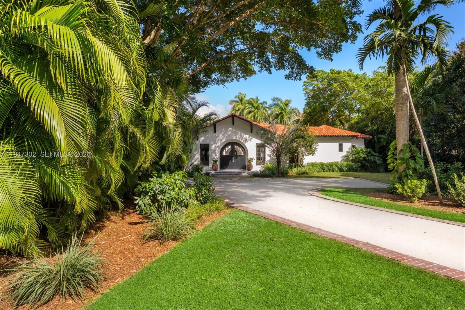 A one-of-a-kind Grand Classic Montecito Estate in Ponce Davis. Offering privacy, sophistication, and modern convenience, this 9,449 Sq Ft, 7BD 6BA home by architect Jenifer Briley and designer Deborah Houston boasts lush landscaping with mature trees and a front entrance courtyard. Inside are custom architectural details, reclaimed French oak floors, custom high-impact Marvin windows and Signature Doors, and a large fireplace, adding timeless charm. A chef’s kitchen features top-tier appliances, and the spacious principal suite offers a spa-like bath and custom walk-in closet. Outdoor spaces include a saltwater pool with jacuzzi, summer kitchen, and covered terraces with exposed wood beams. Smart home automation, a 3-car garage, and luxurious finishes complete this exceptional retreat.