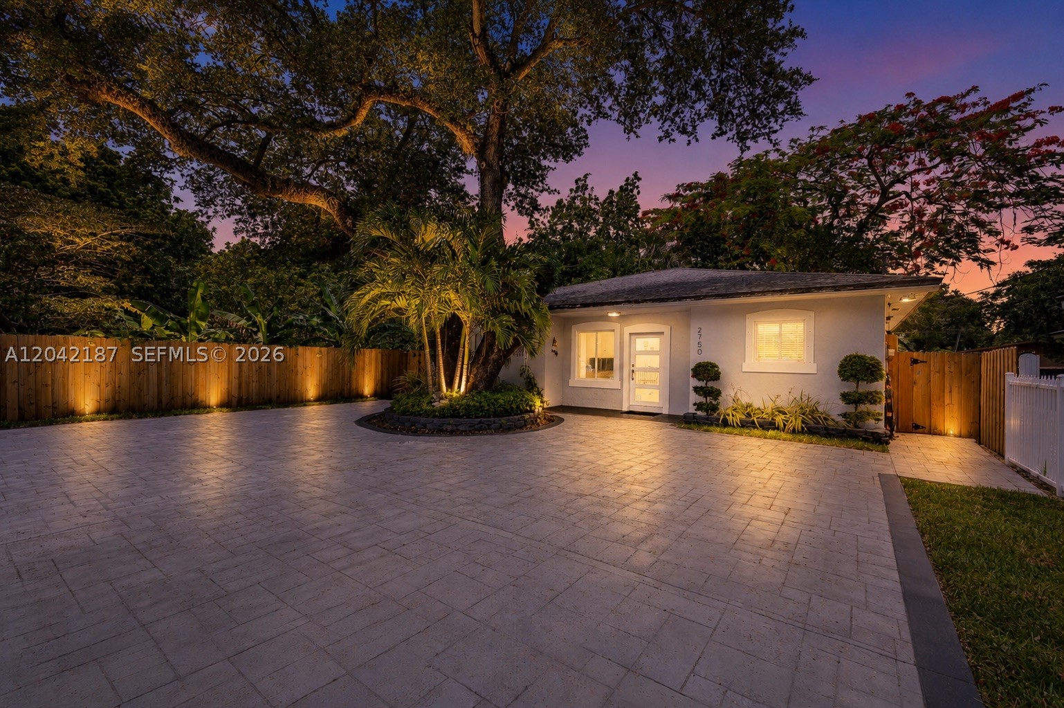 Beautifully maintained home built in 2004 featuring an updated kitchen with granite countertops, wood cabinetry, and stainless-steel appliances. Enjoy a large concrete driveway with ample parking space, tropical landscaping, and a fully fenced front and backyard offering privacy and security. The backyard includes a mature avocado tree, storage shed, and plenty of space for outdoor enjoyment. All exterior doors are impact-rated for added protection and peace of mind. New roof installed in 2020 with a 10-year warranty. Conveniently located just minutes from Hard Rock Stadium, the Palmetto Expressway (SR-826), shopping, dining, schools, and major commuter routes. Move-in ready and ready.