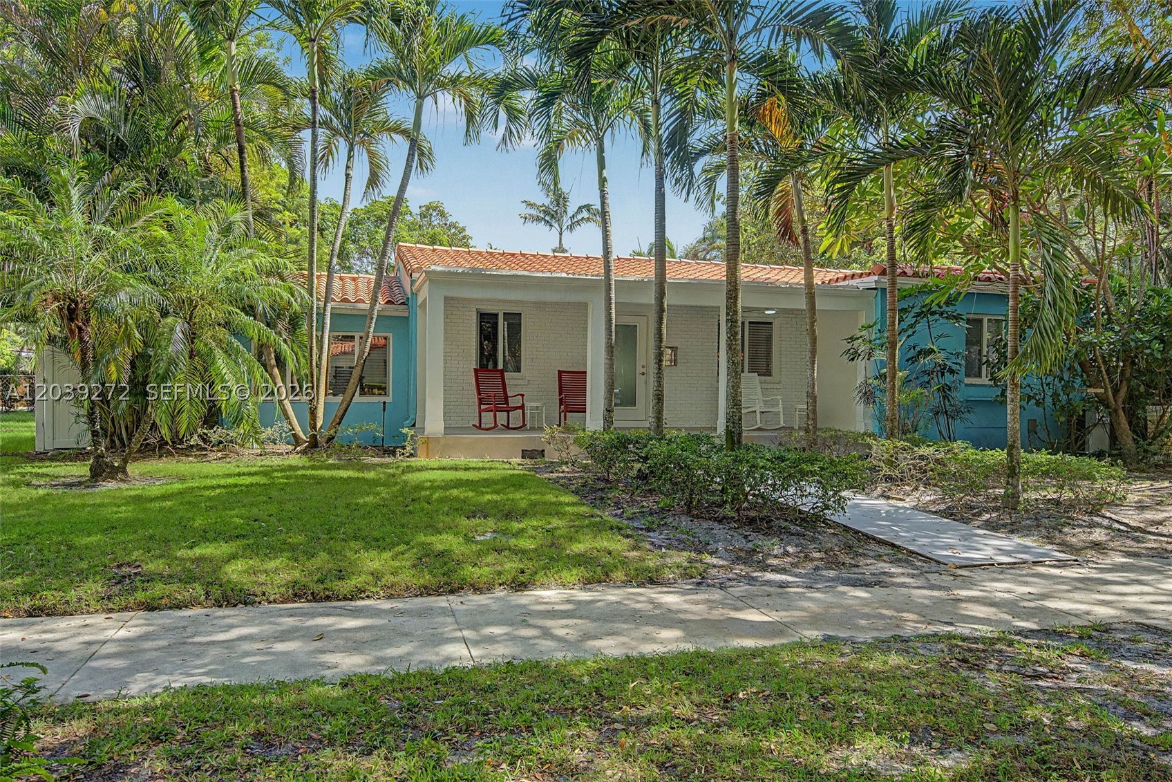Prime opportunity in the heart of Miami Shores offering 2,140 sqft under A/C on one of the most desirable and tranquil streets in the area. This updated 3BR/2BA home delivers strong curb appeal, modern upgrades, and classic charm that stands out immediately. Highlights include a renovated front porch, circular driveway, lush landscaping, and majestic oak-lined street. One-car garage with alley access plus dedicated laundry/hobby room. Interior features real wood flooring and classic terrazzo, beamed ceilings, abundant natural light, cozy brick fireplace, and wide glass doors. Hurricane impact windows and doors throughout provide safety and peace of mind. Kitchen includes wood cabinetry, stainless steel appliances, and quality exhaust system. Primary suite offers french doors to a recently renovated spa-style bathroom and recently updated walk-in closet. Extensive upgrades: newer A/C (last 5 years), newer flat roof, updated plumbing, updated electrical systems, fresh interior/exterior paint, built-in interior & exterior speaker system, and newer PVC perimeter fence. Outdoor space offers a spacious backyard with room for entertaining or future pool. Enjoy front porch or wood deck surrounded by mature oaks, birds, and butterflies. Strong combination of location, condition, and value — easy to show and ready for its next owner. Homes like this in Miami Shores rarely come to market in this condition and location.