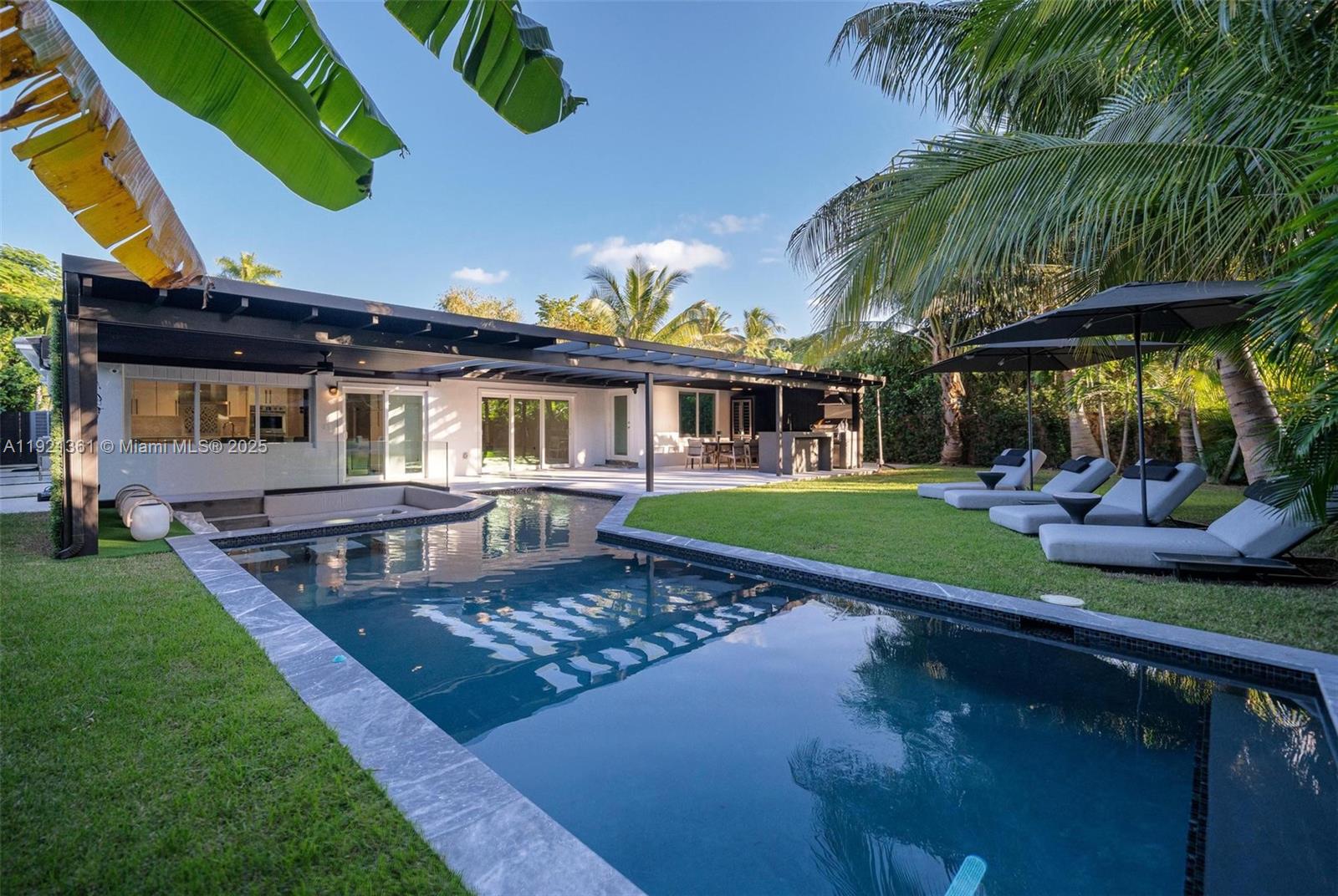 Welcome to OASIS — the home that doesn’t just impress, it performs.
With over 3,000 sq ft of enjoyable area, this residence elevates Miami Shores living through intentional design, natural light, and a lifestyle-driven layout. Expansive open spaces flow into a chef-level induction kitchen with an oversized island, professional refrigeration, and dual dishwashers for seamless entertaining. A dedicated wine room offers the perfect showcase for collectors and wine lovers.

Featuring 3 spacious bedrooms plus a den, OASIS adds versatility for work, creativity, and comfort. The garage is already prepared for a high-performance home gym, delivering functionality rarely found. Outside, a heated saltwater pool, full outdoor kitchen, BBQ terrace, screened patio, and lush greenery transform every day into a private resort experience.

With designer flooring, impact windows/doors, updated electrical, newer roof, and $500,000+ in premium upgrades, this home feels brand new from every angle. Perfectly located near Miami Shores’ golf courses, parks, bay access, and top-rated schools.

And here’s what truly sets it apart: there is no other home like this in Miami Shores — OASIS is genuinely one-of-a-kind.

In a market full of look-alikes, this home leads.
OASIS isn’t meant to be seen — it’s meant to be experienced.