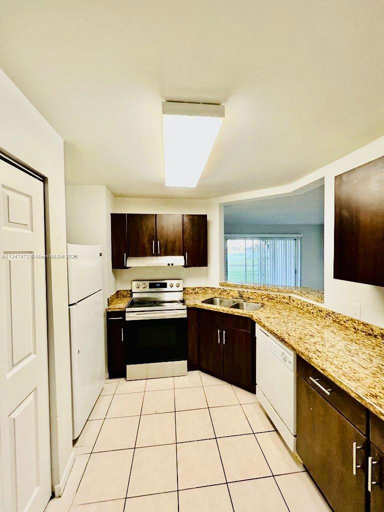 FRESHLY PAINTED - investor special at Summer Lake. 2 bed 2 bath Condo on ground floor with a full-size washer and dryer in the unit.