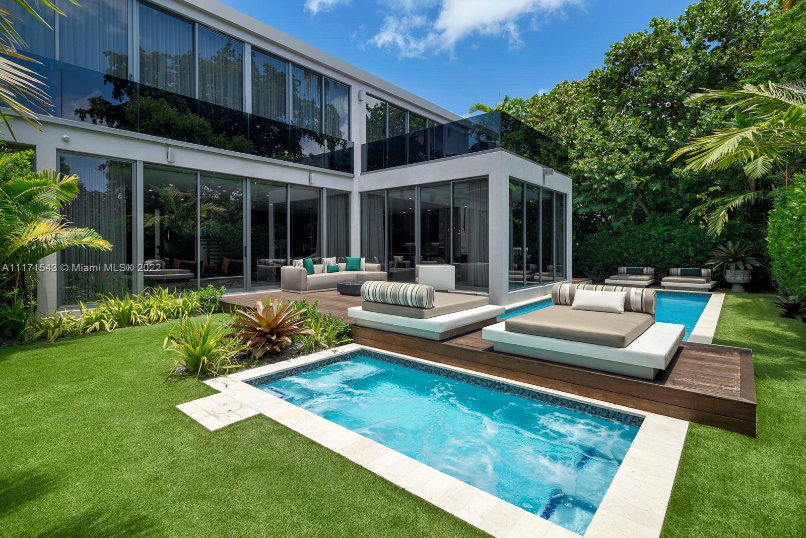 Newly-built tropical modern home boasting approx. 6,000SF of exceptionally designed luxurious living space flawlessly connecting with the exterior. Professionally designed interior and landscaping. Home being offered furnished turn key. Built by Hoffman & Billskoog Construction. Expansive 6 bedroom, 6.5 bath new construction home delivers exceptional luxury living in the heart of Miami Beach. Lush private backyard, bbq grill & deck, oversized terraces, large private pool and jacuzzi. Elegant features include European oak and marble floors, Wolf & SubZero appliances, steam room, yoga den, air filtration & radon mitigation system, media room, garage. Curated to perfection! Minutes from South Beach, Bal Harbour and Design District with all the best restaurants and shopping.