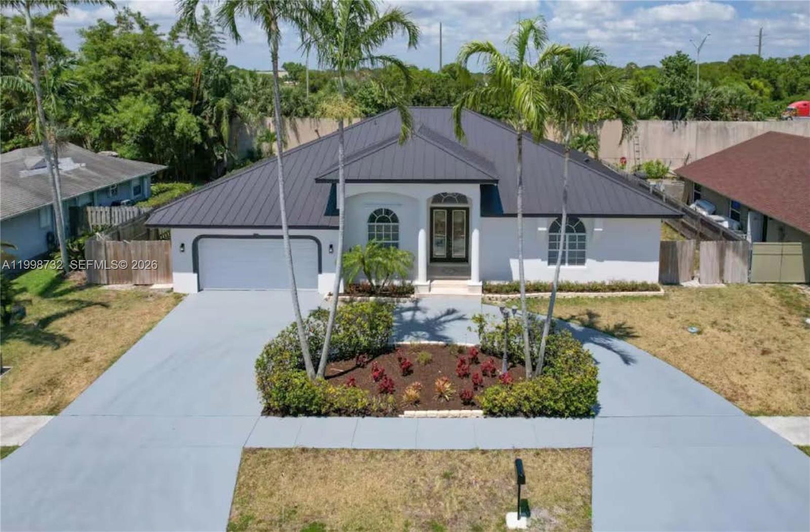 Welcome to your private, fully renovated coastal retreat ideally positioned between Boynton Beach and Delray Beach—where modern luxury meets effortless South Florida living. This stunning 5-bedroom, 3-bathroom residence spans 2,999 square feet of beautifully curated living space and comes fully furnished, offering a turnkey experience perfect for immediate enjoyment or high-end rental potential. The home features a bright, open-concept layout filled with natural light, creating an inviting atmosphere throughout. The chef’s kitchen is outfitted with premium finishes, ample counter space, and seamless flow into the main living and dining areas—ideal for entertaining or hosting large groups. The King master suite serves as a true sanctuary, complete with dual vanities and a spa-like feel, while the additional guest rooms are thoughtfully designed to accommodate up to 15 guests comfortably—making this property perfect for families, vacationers, or investors seeking strong short-term rental income. Step outside into your own resort-style backyard oasis, where a heated pool and spa are surrounded by a spacious patio—perfect for relaxing, entertaining, or enjoying the year-round Florida sunshine in total privacy. Located just minutes from the vibrant energy of Downtown Delray Beach, pristine beaches, top dining, and shopping—and only a short 20-minute drive to Palm Beach International Airport—this home offers the perfect balance of convenience, luxury, and coastal charm.