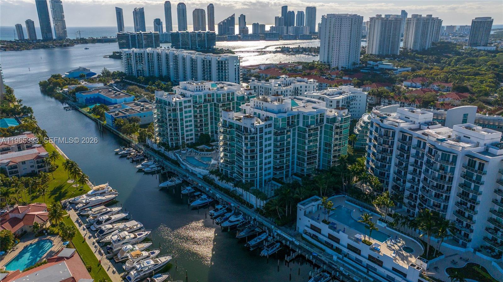 Rarely available lower penthouse corner residence in the heart of Aventura — a layout that has not hit the market in many years. Enjoy breathtaking ocean and bay views from two expansive wraparound terraces. This 3BD + den, 2.5BA home features cappuccino marble floors, a fully renovated European kitchen with granite countertops perfect for any chef, and a stunning spa-like renovated primary bath. Spacious walk-in closets and two covered parking spaces included. Resort-style amenities: waterfront fitness center, pools, marina, sauna & more. Truly one of a kind!