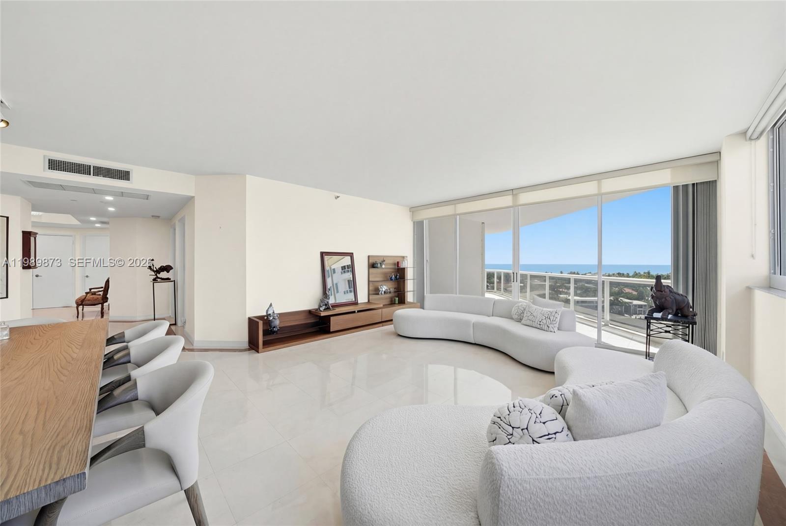 Experience luxury living in this stunningly renovated 3-bedroom 3-bathroom plus den residence situated within the exclusive One Island Place. This meticulously upgraded home features a private elevator foyer that opens into a splendid floor plan characterized by elegant ceramic and marble flooring throughout. Enjoy breathtaking, unobstructed views of the Ocean and Intracoastal Waterway from every living space, including the beautiful and spacious balcony. The interior boasts a modernized kitchen and renovated bathrooms, offering a sophisticated aesthetic.
This versatile layout is a three-bedroom sanctuary with three full bathrooms, a separate laundry room for ultimate convenience, PLUS a separate Den/Office space. Residents benefit from significant peace of mind as the building has recently undergone a complete transformation, including sleek new lobbies and modernized elevators. The unit includes two covered parking spaces plus valet. Located in a premier development, the property offers amenities including two resort-style pools, a fitness center, tennis courts, and 24/7 security, all within walking distance of the Waterways. This exceptional property is easy to show; please REVIEW **BROKER remarks for *showing instructions.