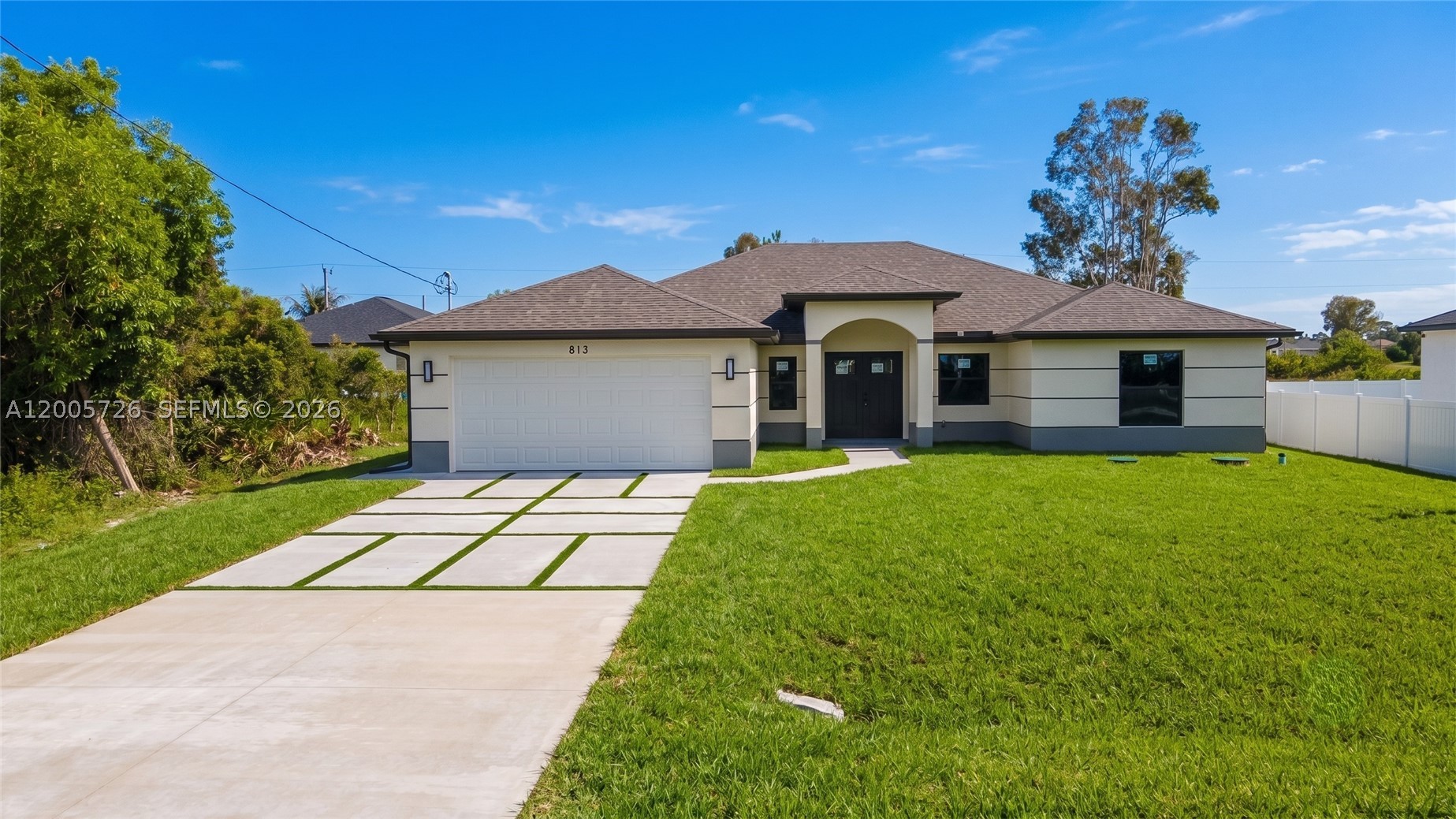 Welcome to 813 Bell Blvd S, a beautifully designed 3,000 sq ft retreat in Lehigh Acres where space, style, and comfort come together effortlessly. The seller is offering $15,000 toward the buyer's closing costs with a full-price offer, adding exceptional value from day one. This thoughtfully crafted 4-bedroom, 3-bathroom home features impact-resistant windows and doors, LED lighting, and modern tile flooring throughout. The chef's kitchen is the heart of the home, showcasing a quartz island, soft-close wood cabinetry, and stainless-steel appliances—perfect for entertaining or enjoying everyday luxury. The primary suite serves as a private sanctuary, complete with dual walk-in closets, dual vanities, and a spa-inspired walk-in shower designed for relaxation. Situated in a no-HOA, non-gated neighborhood, the property offers easy access to SR-82, I-75, Fort Myers, and RSW Airport. You're just minutes from beaches, golf courses, nature preserves, and parks, making it ideal for weekend adventures and memorable family moments. Bring your best offers—this home delivers the lifestyle buyers are searching for.