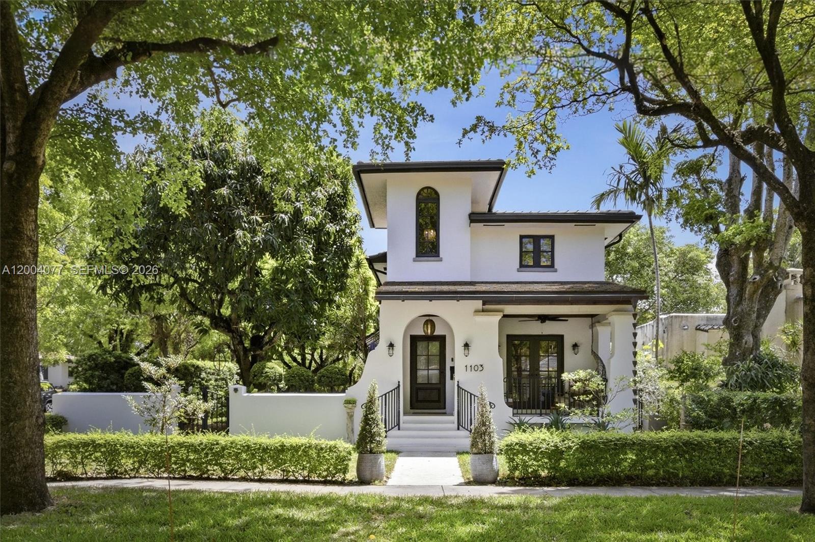 Coral Gables Mediterranean-modern farmhouse completely renovated inside & out to create a bright, airy and textured aesthetic. New kitchen fully remodeled 2025 w/quartz countertops, solid wood cabinets, Bosch dishwasher, Kitchenaid combo micro/convection/airfryer dble oven, induction cooktop, Samsung Bespoke 4-door refrigerator. Newly installed premium wide-plank white oak engineered hardwood. Porch and stairwell tower feature elegant tongue-and-groove woodwork on ceilings. 3 full baths totally updated, 2 upstairs (2020) and 1 downstairs (2026). Architectural series impact windows & doors: CGI series casement windows and French doors. Home offers wonderfully curated outdoor zones, comprised of classic elevated front porch completed 2020, connected to the living rm by French doors. Superb side yard creates a lovely outdoor living room enclosed by 1-foot-thick garden wall lined w/podocarpus hedge w/2-zone irrigation system. Master bedrm connects by French doors to a dual-layer outdoor terrace featuring a covered 2nd floor arcaded loggia & open sundeck for private relaxation on newly installed white shellstone tile. Reinforced masonry walls and floor/ceiling slab construction. Concrete tile hip roof from (2017). CGI Estate series impact windows & French doors (2017-2020) Custom signature collection mahogany impact door (2020). Located in a premium quiet neighborhood in a top-tier school district. Walking distance to Gables shops& restaurants, CG Country Club w/pool, gym, tennis.