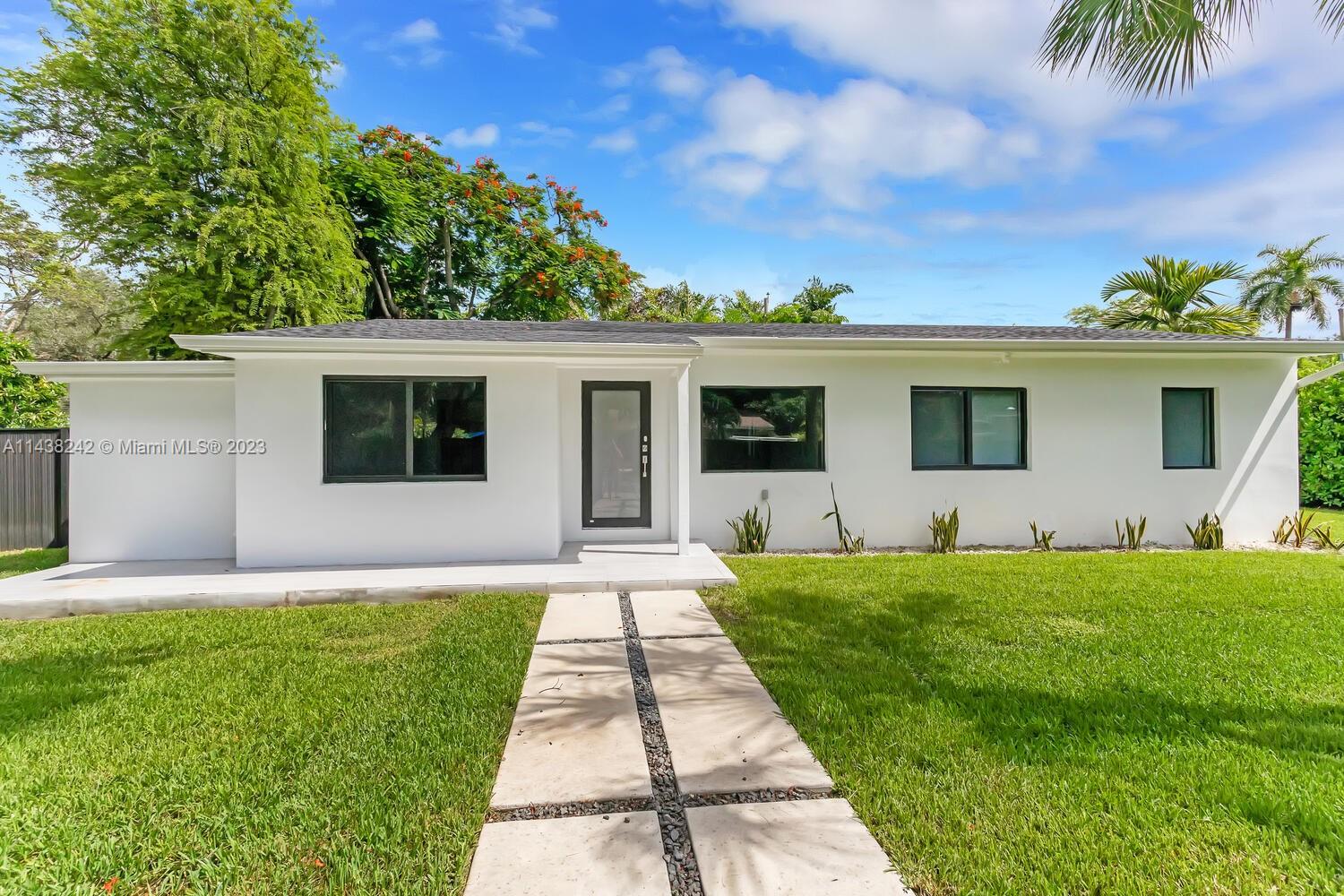 Immaculate 2020-renovated home, no detail spared. Comprehensive upgrades included plumbing, roof, electric, septic, impact windows/doors for modern comfort/security. Primary suite is a haven with walk-in closet, dual-sink bath, dual showers, flex space for vanity/computer. Split bedroom layout adds privacy, with 2-bed/1-bath on each side. Spacious laundry, well-equipped kitchen with abundant counter/cabinet space. Mudroom/pantry, flexible area enhance organization. Vast front/back yards, poolside terrace, new privacy fence invite outdoor enjoyment. Opposite Coral Gables, prized for David Fairchild Elementary, easy access to stores, dining, beaches, downtown, and MIA.