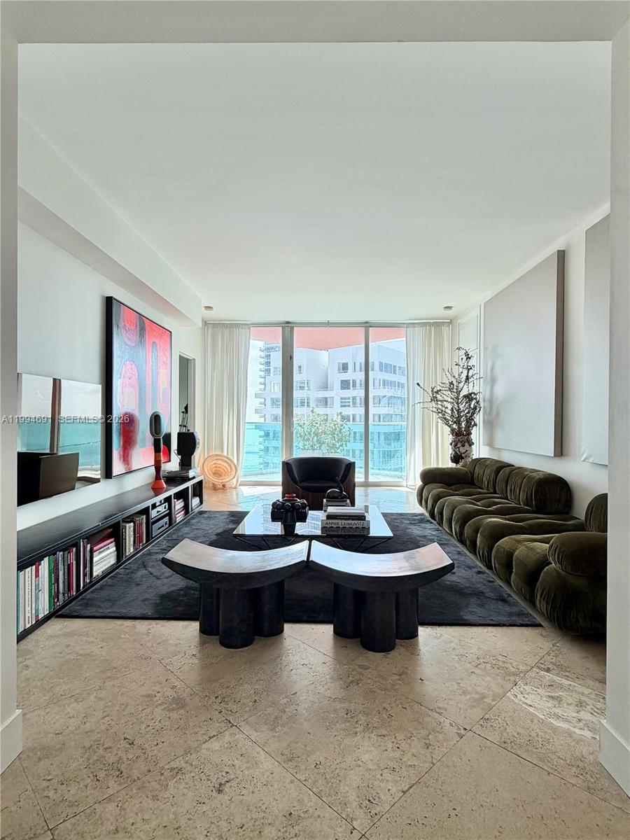 Step into luxury living at Portofino Tower in the world renowned South of Fifth neighborhood! This newly updated 2-BEDROOM + DEN 2.5 bath flow-through residence boasts an open floor plan & breathtaking views of the Atlantic Ocean, Biscayne Bay, Miami Skyline & private islands of Miami. Enjoy both sunrises and sunsets every morning and evening! Large eat-in kitchen with stunning city/water views, updated cabinetry & appliances. A spacious primary bedroom suite with walk-in closets, walk-in shower, jacuzzi, & dual vanities. Guest bedroom with walk-in closet & ensuite bath; & den/office great for multiple uses. Portofino has a new lobby, new elevators, new pools with cabanas & hot tub, tennis/pickleball/basketball courts, dog parks & BBQ areas, valet, concierge & security