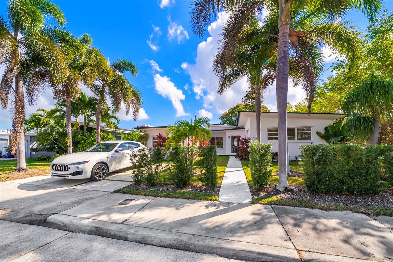 Remodeled 4-bedroom, 3-bath home offering 2,200 sft of refined living space, with rare to find 10 FT ceilings, and located in rapidly evolving North Bay Village, undergoing significant transformation with premier developments including Continuum North Bay Village, Shoma Bay, Sunbeam Towers and AFA training facilities shaping the area’s future. This move-in ready home showcases thoughtful upgrades throughout, including a brand-new roof, new flooring, New AC System, a beautifully redesigned kitchen with new appliances, modern cabinetry and contemporary finishes, as well as fully updated bathrooms. Fresh interior and exterior paint enhance the home’s clean, sophisticated aesthetic. Designed for effortless living and entertaining, the open-concept layout features expansive living and dining areas filled with natural light, complemented by a Florida room overlooking the backyard that provides versatile additional space. A generous covered patio creates an inviting outdoor setting with room to design a custom pool and elevate the outdoor lifestyle experience. The fourth bedroom is a converted garage with a full bathroom, ideal as a guest suite, private office, fitness space or additional living quarters. Enjoy a peaceful residential environment with convenient access to Miami Beach, major roadways, dining, shopping and entertainment, offering a rare opportunity to own a turnkey home in one of Miami’s most exciting emerging neighborhoods.