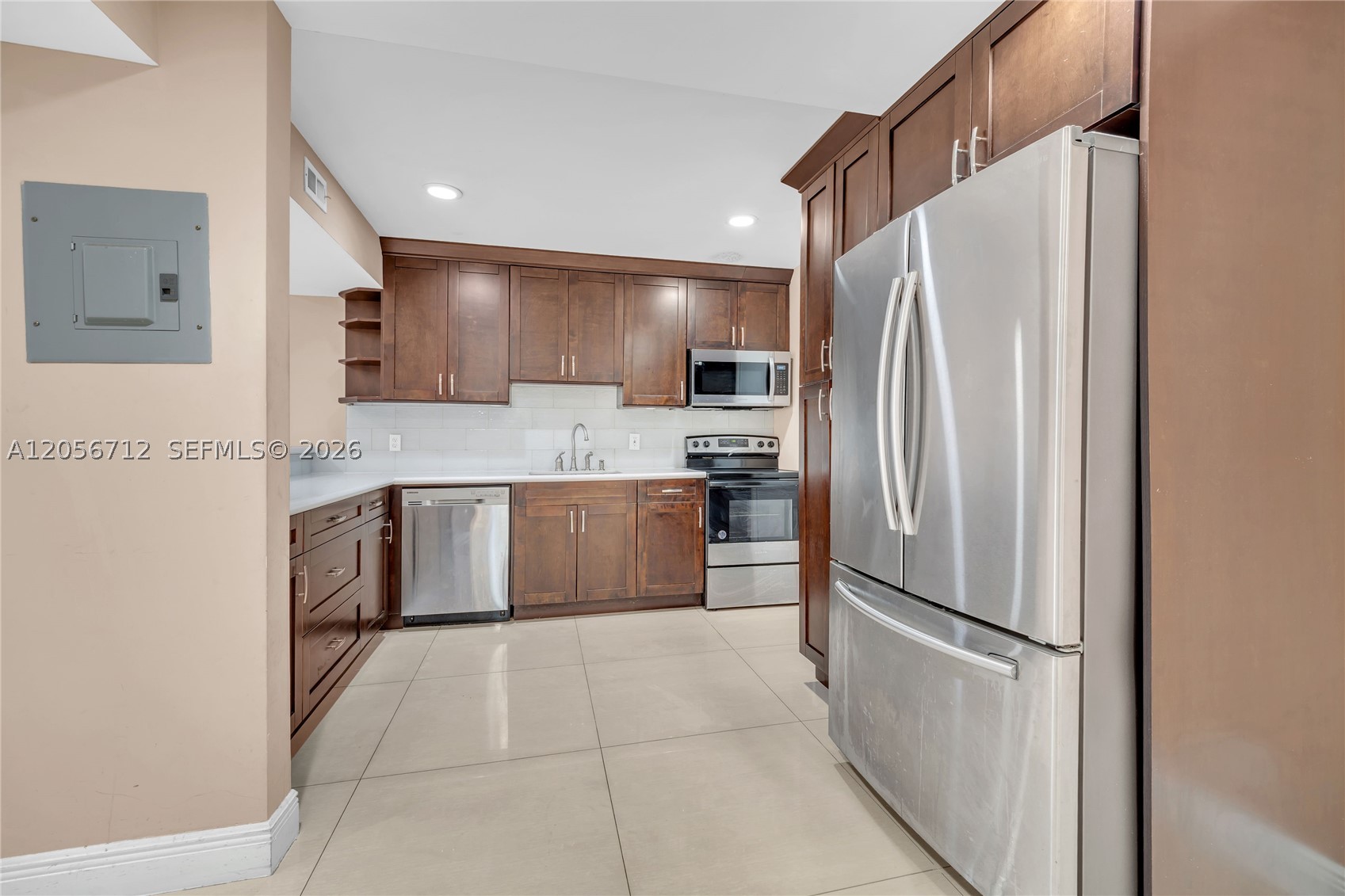 Welcome to this beautiful remodeled 2-bedroom, 2-bathroom condo, where modern style meets convenience, located on the first floor, this spacious unit welcomes you with an open layout and abundant natural light. The Sleeky redesigned kitchen and bathroom reflect thoughtful attention to every detail. With two large bedrooms, ample storage, private patio an in unit washer-dryer this condo is designed for easy living and entertaining. Conveniently situated near major highways, shopping centers, and beaches it offers the ideal blend of comfort and accessibility.