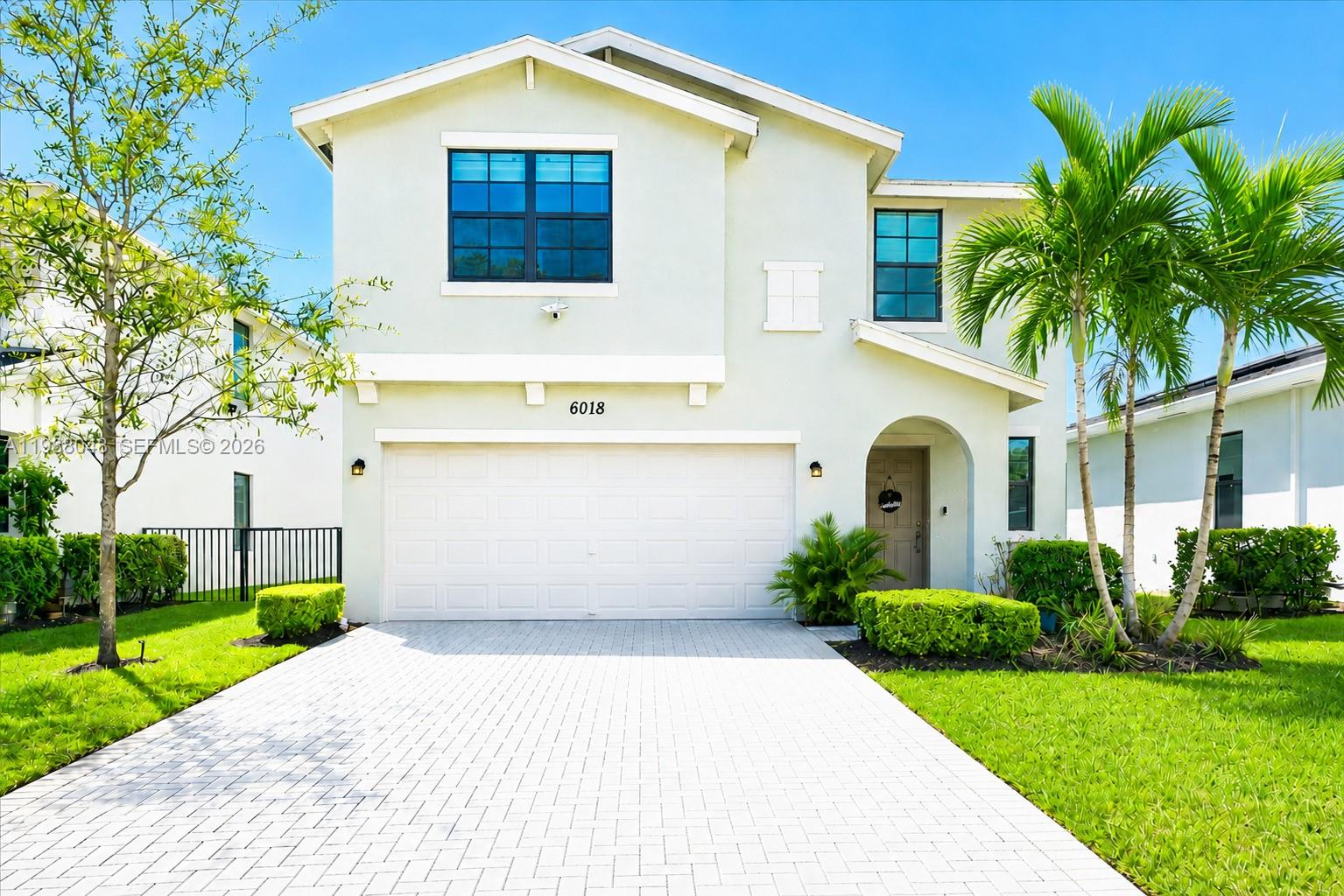 Welcome to this stunning lakefront home located at 6018 Henderson Way in West Palm Beach! Built in 2021, this beautifully upgraded 5-bedroom, 3-bath residence offers over $100,000 in premium enhancements and modern finishes throughout. Featuring impact windows and doors for added safety, energy efficiency, and peace of mind, this home truly has it all.

A major benefit for buyers—enjoy fully paid-off, brand new solar panels valued upto $30,000, delivering significant energy savings from day one, along with a dedicated electric vehicle charging port, perfect for modern living.

Enjoy a spacious open-concept layout with a fully renovated garage featuring custom cabinetry and upgraded flooring, as well as a whole-home water softener system for added comfort. Step outside to your brand-new permitted patio and take in serene lake views—perfect for relaxing or entertaining guests.

Located in a well-maintained community with lawn maintenance included, this home offers a low-maintenance lifestyle. Plus, enjoy the convenience of a community pool and park just a 2-minute walk away, ideal for recreation and family time.

Ideally situated just minutes from a major golf course, including the prestigious Trump International Golf Club, and only 10 minutes from Palm Beach International Airport, this home offers both luxury and convenience.

Don’t miss this exceptional opportunity to own a move-in ready waterfront property in one of West Palm Beach’s most desirable communities!