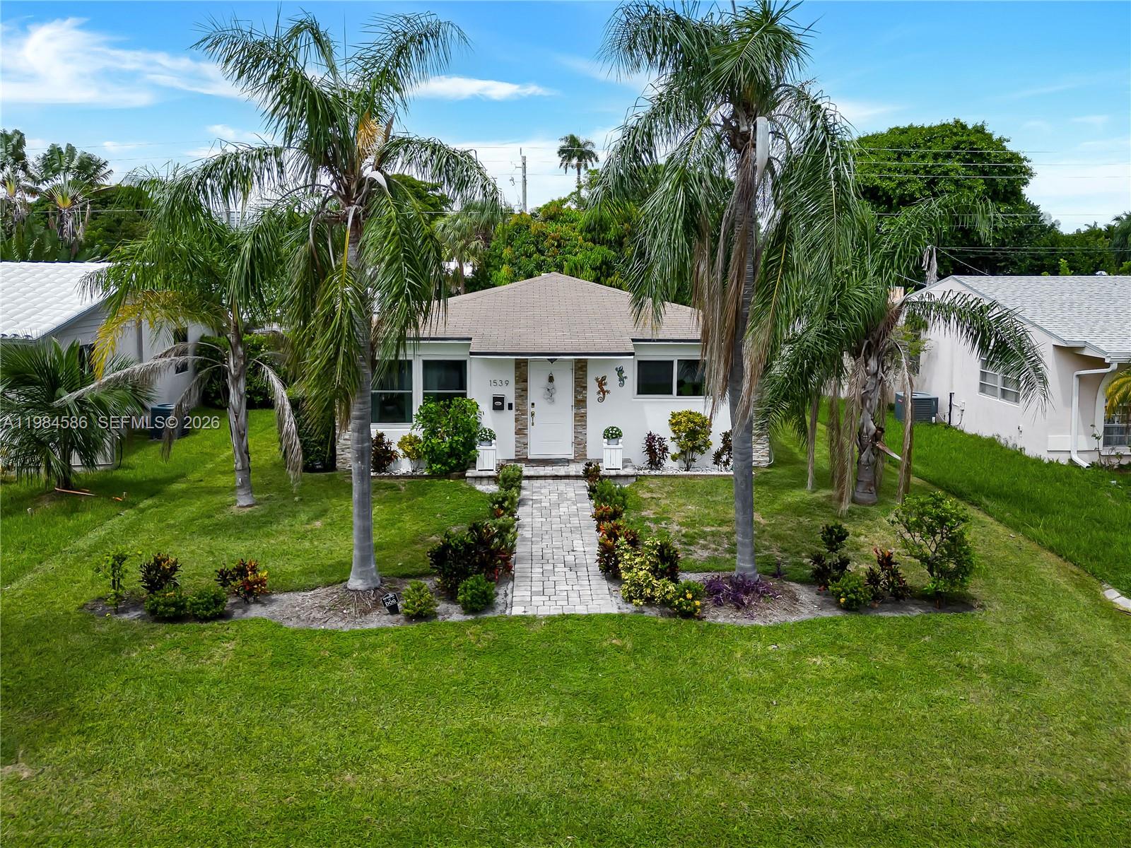 ***BACK ON MARKET WITH $50,000.00 PRICE DECREASE***
HIGHLY DESIRED EAST HOLLYWOOD RESIDENCE MINUTES TO BEACHES, AVENTURA & DOWNTOWN HOLLYWOOD. AS PER TAX ROLLS ADJUSTED SQUARE FT. IS OVER 1000! DESIGNER DETAILS THROUGHOUT THIS RENOVATED GEM. 2 FULL BEDROOMS WITH 1.5 BATHS PLUS GARAGE! MODERN TOUCHES MEEET RETRO INSPIRATION IN THIS STUNNING HOME. GOURMET KITCHEN WITH TOP OF THE LINE "BIG CHILL" APPLIANCES, STYLISH CABINETS, TILED BACKSPLASH & WOOD PLANK CEILINGS! NATURAL LIGHTING ADDS TO THE SPACIOUS FEEL OF THE MAIN LIVING AREAS. IMPACT WINDOWS, DOORS & ROOF ARE 5 YEARS OLD FOR ADDED PROTECTION! DESIGNATED LAUNDRY AREA WITH NEWER WASHER & DRYER! THE FENCED IN BACKYARD IS PERFECT FOR ENTERTAINING WITH CUSTOM TIKI HUT! LARGE REAR DRIVEWAY FOR MULTIPLE VEHICLES. THE EXTERIOR OF THIS HOME HAS IMMEDIATE CURB APPEAL WITH MODERN STACKED STONE!!