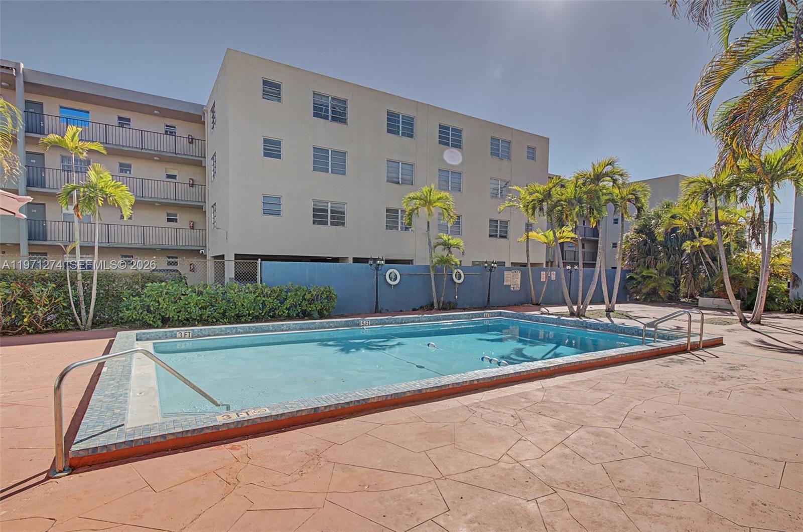 Location, location!! Beautifully remodeled 2 bedroom/1.5 bath condo located in the gated community of Villas San Miguel. This spacious unit boasts a modern open floor plan with granite counter-tops in kitchen, kitchen island, stainless steel appliances, and custom cabinetry. Enjoy a private open balcony, 2 assigned parking spaces - 1 covered, and washer/dryer in unit. Master bed features walk-in closet, tile and laminate throughout and extra storage closet under stairs. Impact windows throughout.  Association requires 20% down if financing. Prime location with easy access to major highways, minutes from Miami International Airport, shopping, dining, and more.