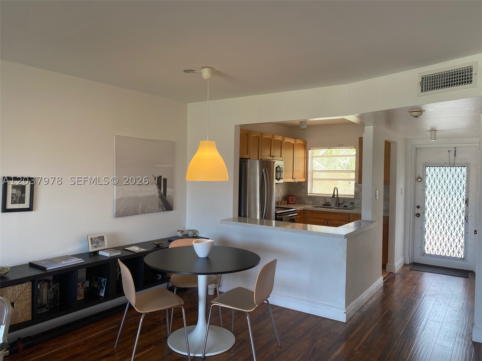 3rd top floor unit overlooking the canal.  Beautiful open kitchen with quartz counters, engineered wood floors, patio with scerene views.  This community has many amenities, Indoor and Outdoor pools, sauna, billiard room, BBQ area, tennis, golf, gym, theater, clubhouse.  HOA fees include water, cable, wifi, pest control, master insurance, reserves and service appliance contract.