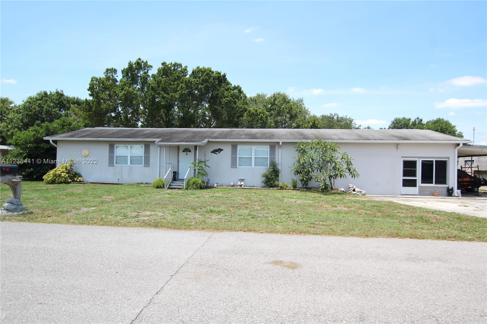 LAKE OKEECHOBEE ACCESS - DOUBLE LOT - 4/3 home value with elegance, irrigation system, carport 12 x 18,shed 8 x 20, garage 20 x 25 with an efficincy or a man cave, seawall concrete block, Gazebo 10 x 10.  This is a lovely spacious home in a quiet and preacefull neighborhood where the community cares.