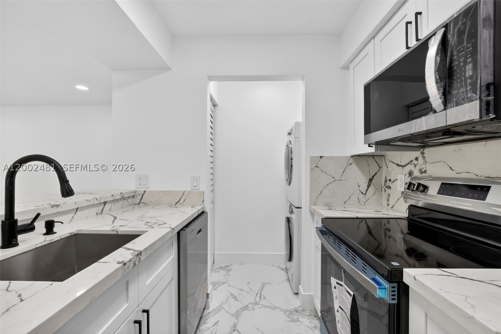 Beautifully renovated condo in the heart of Pompano Beach! This unit has been substantially upgraded with a modern, clean design throughout- featuring large-format porcelain tile flooring, a fully remodeled kitchen with quartz countertops, white cabinetry, and all brand-new stainless steel appliances.

The open layout offers bright living spaces that flow seamlessly, enhanced by contemporary finishes, recessed lighting, and a stylish ceiling fan. The bathroom has been completely updated with a modern vanity? and a glass-enclosed shower, creating a spa-like feel.

Additional features include? brand new in-unit washer and dryer,? storage? closet, screened in balcony, and assigned parking. Th?is gated community offers peaceful lake views, walking paths, ?a gym, and a resort style pool.

A turnkey opportunity perfect for end users or investors?. Can rent immediately, low HOA.